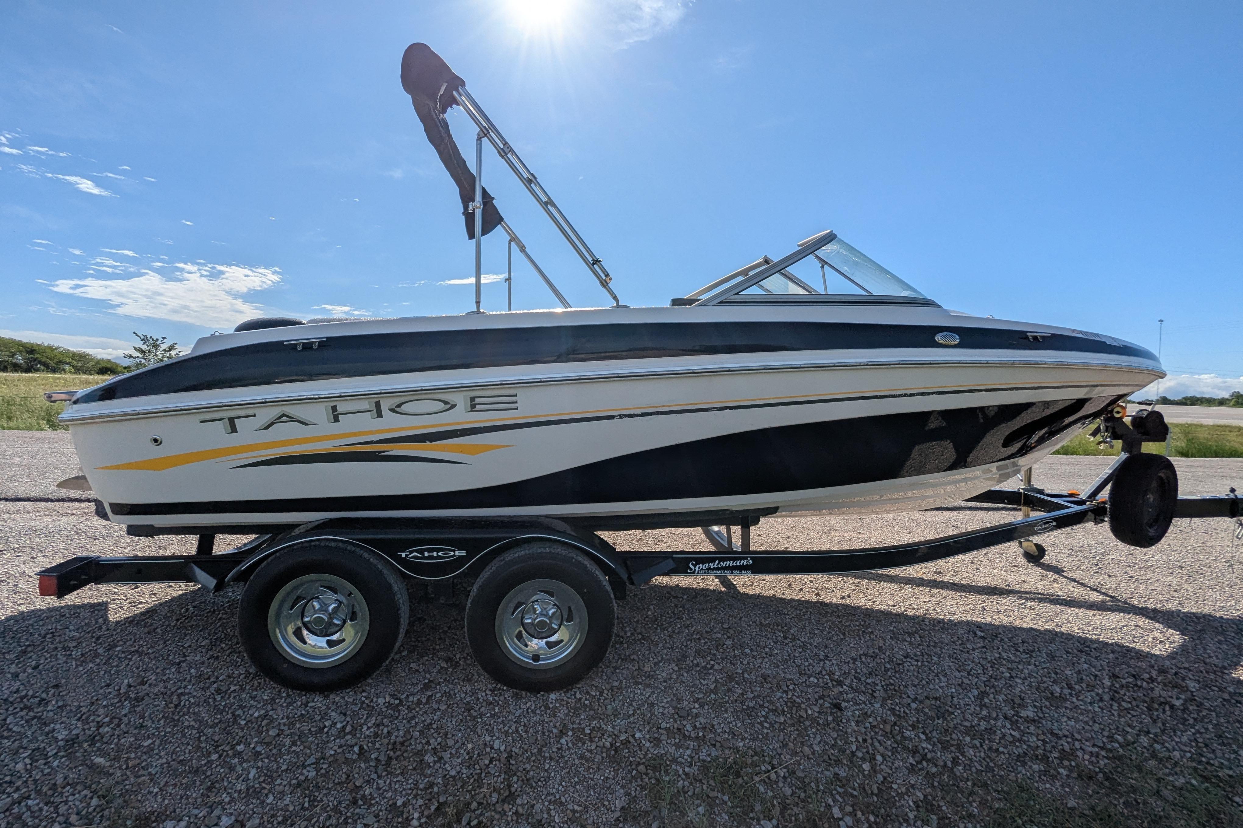 2006 Tahoe Q6 Sport boat on trailer under clear blue sky.