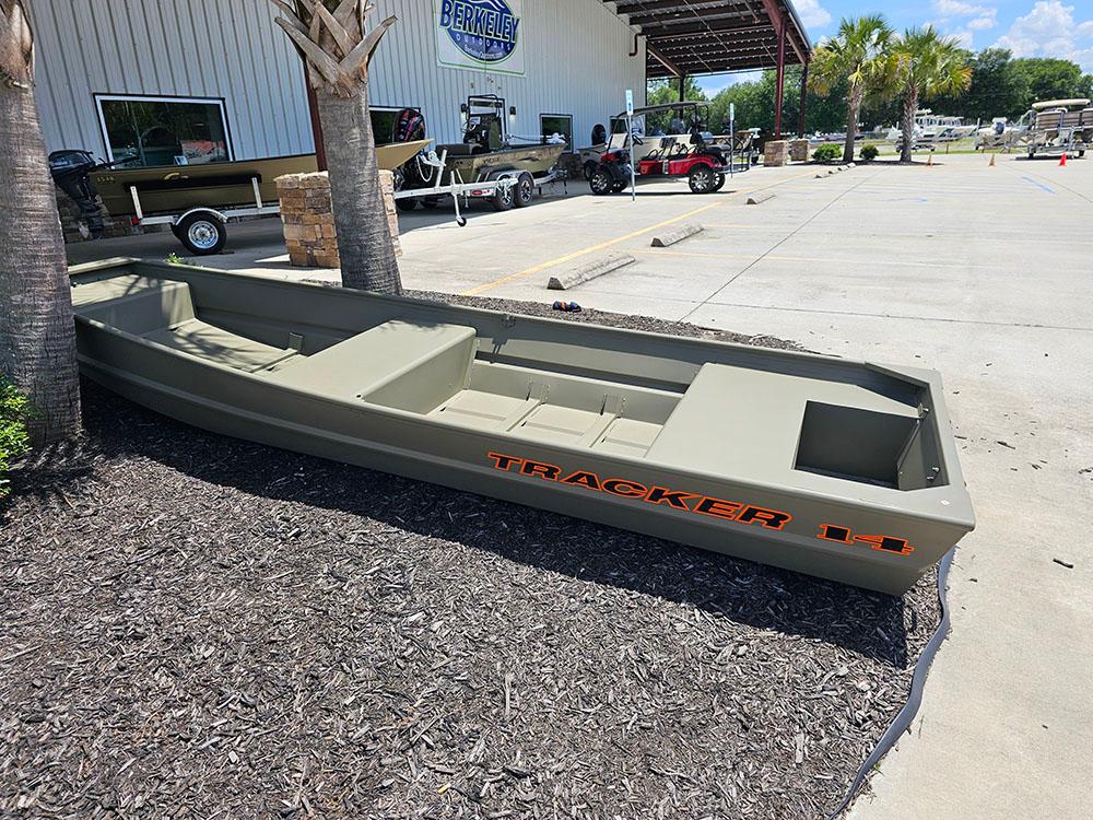 2025 Tracker Grizzly 14 Jon boat displayed outdoors near a dealership.