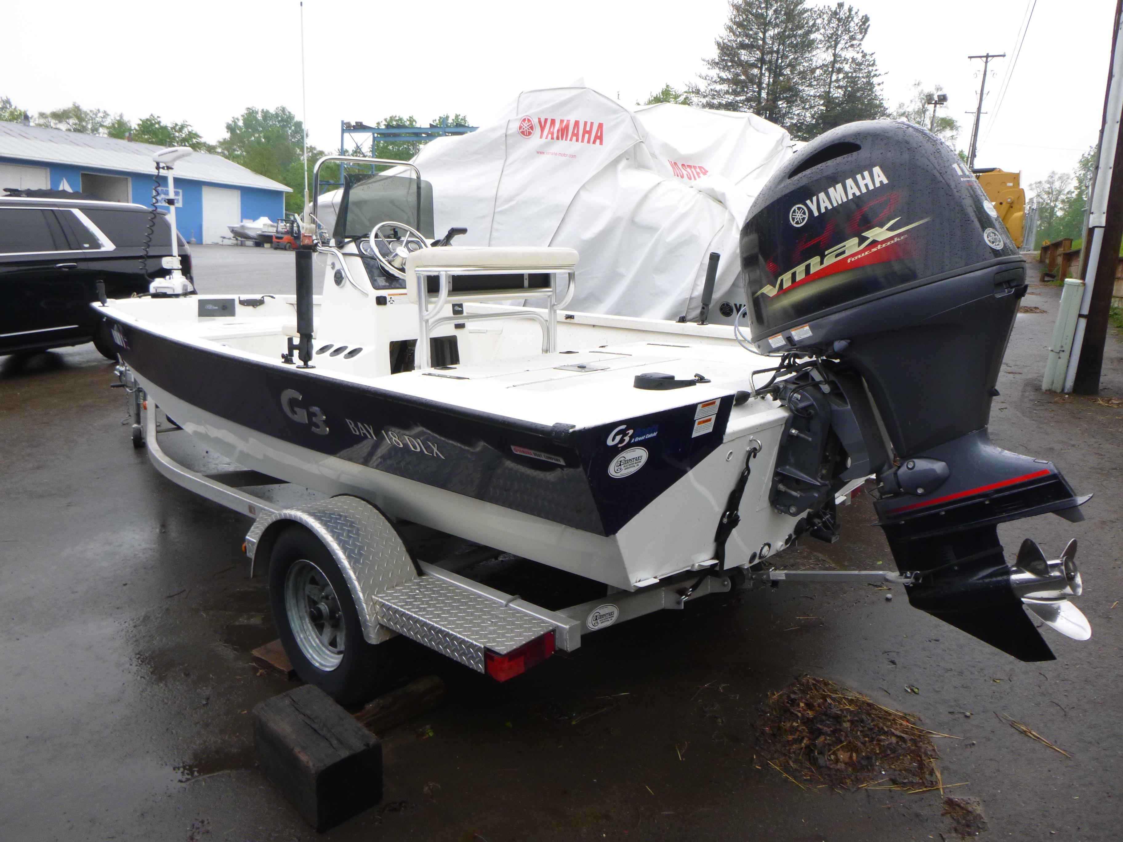 2017 G3 Bay 18 DLX boat with Yamaha engine on trailer.