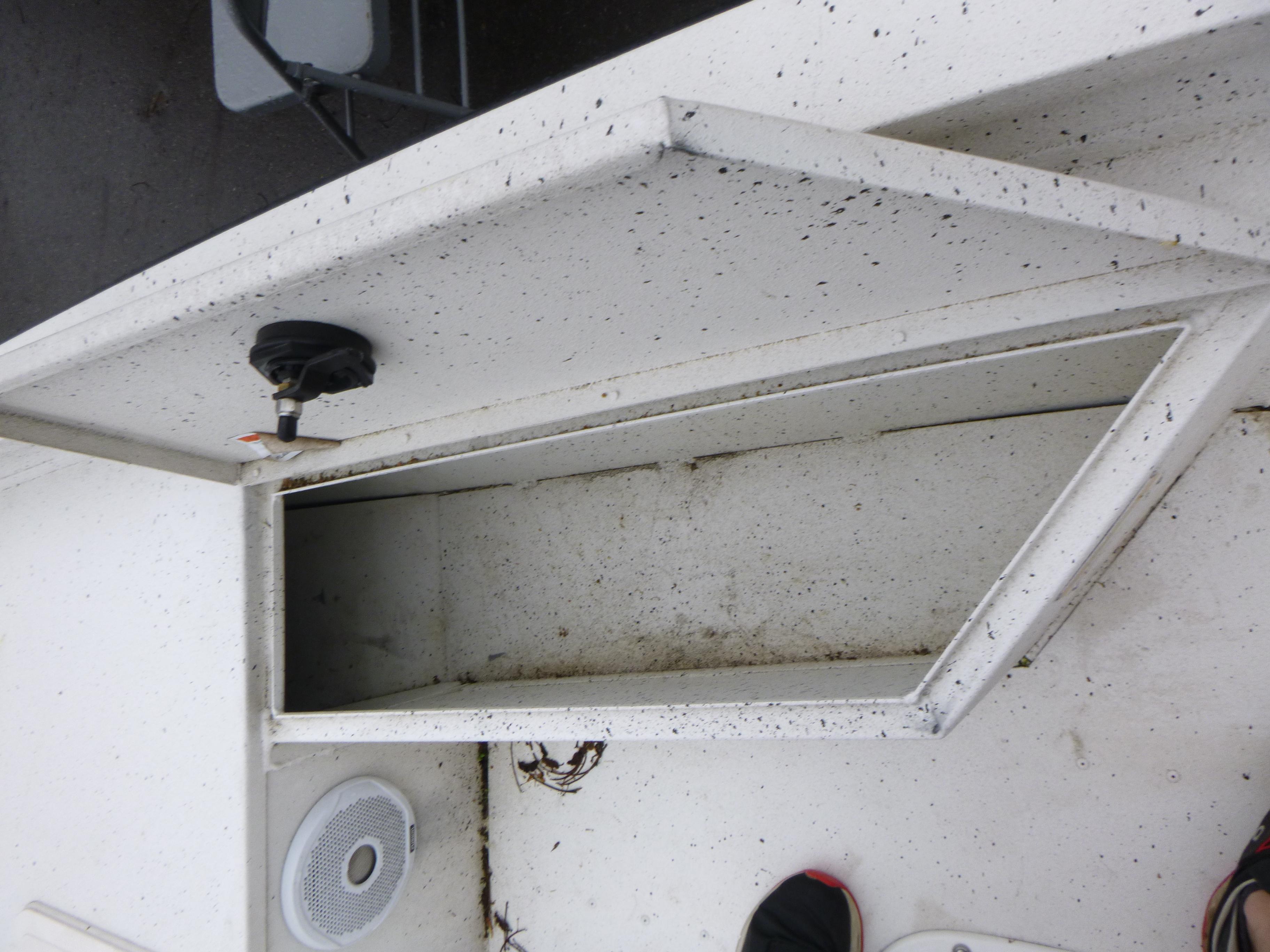 2017 G3 Bay 18 DLX boat storage compartment with speaker and latch.