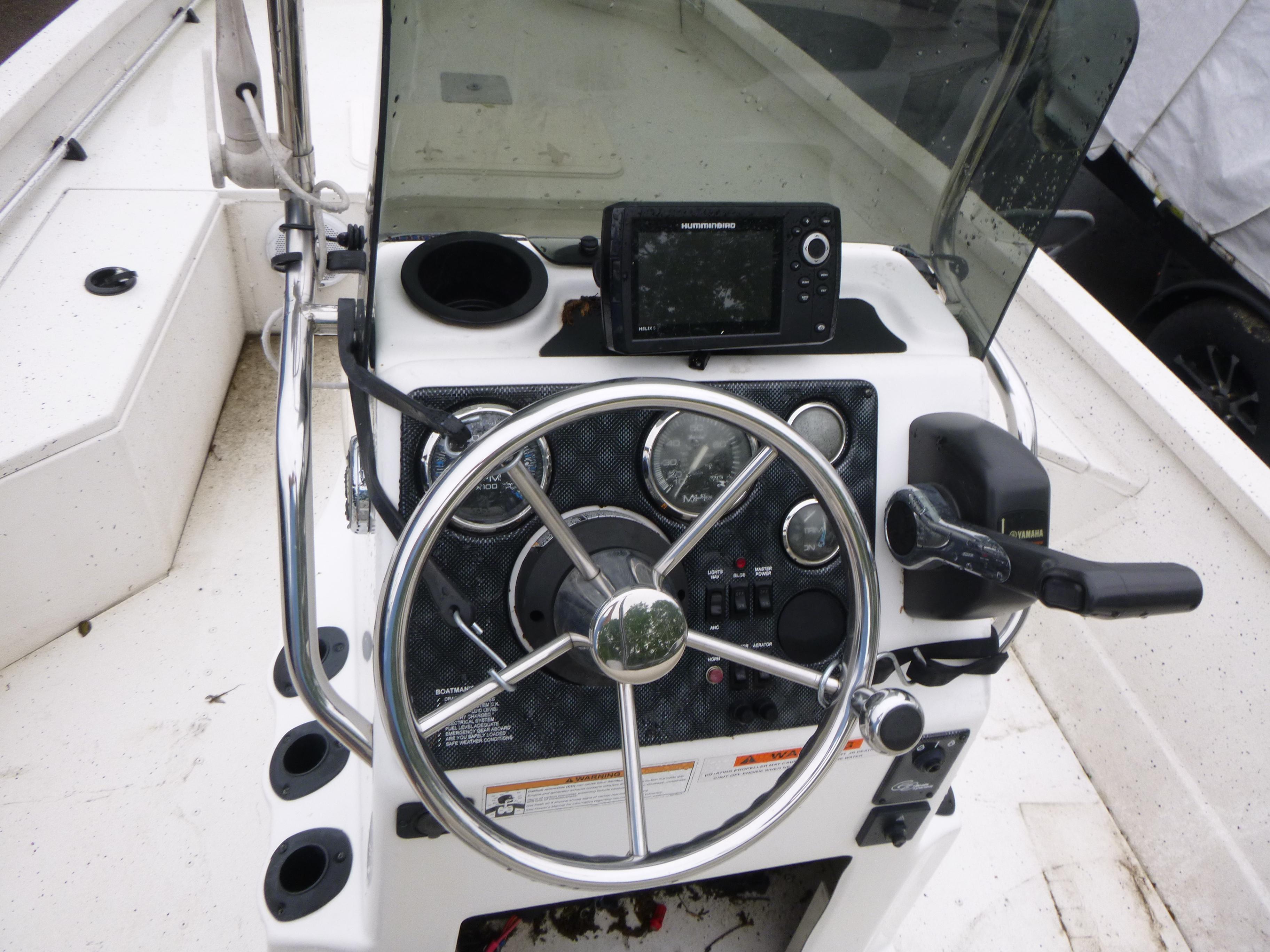 2017 G3 Bay 18 DLX boat console with steering wheel and navigation system.