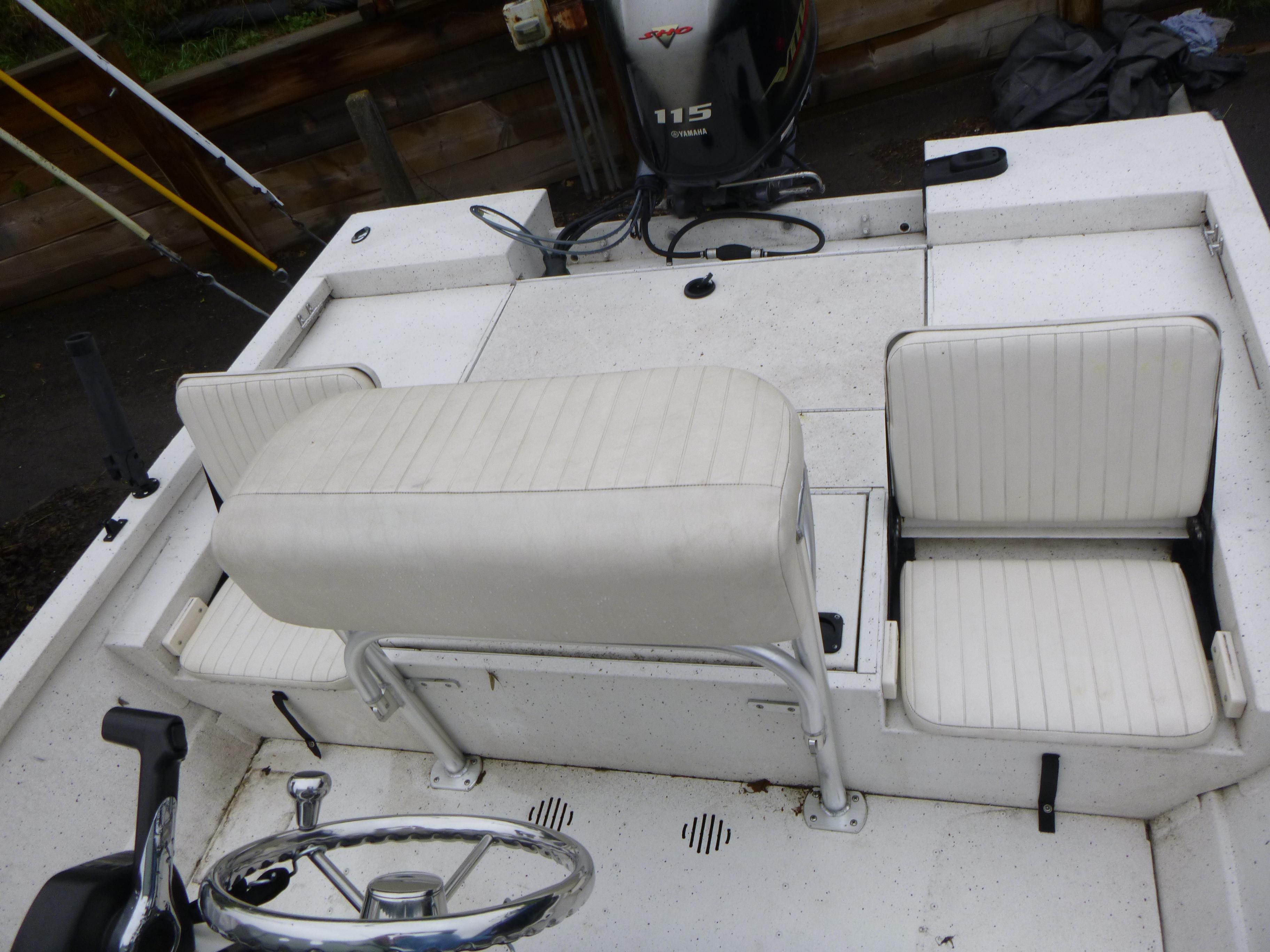 2017 G3 Bay 18 DLX boat interior with white seating and steering wheel.