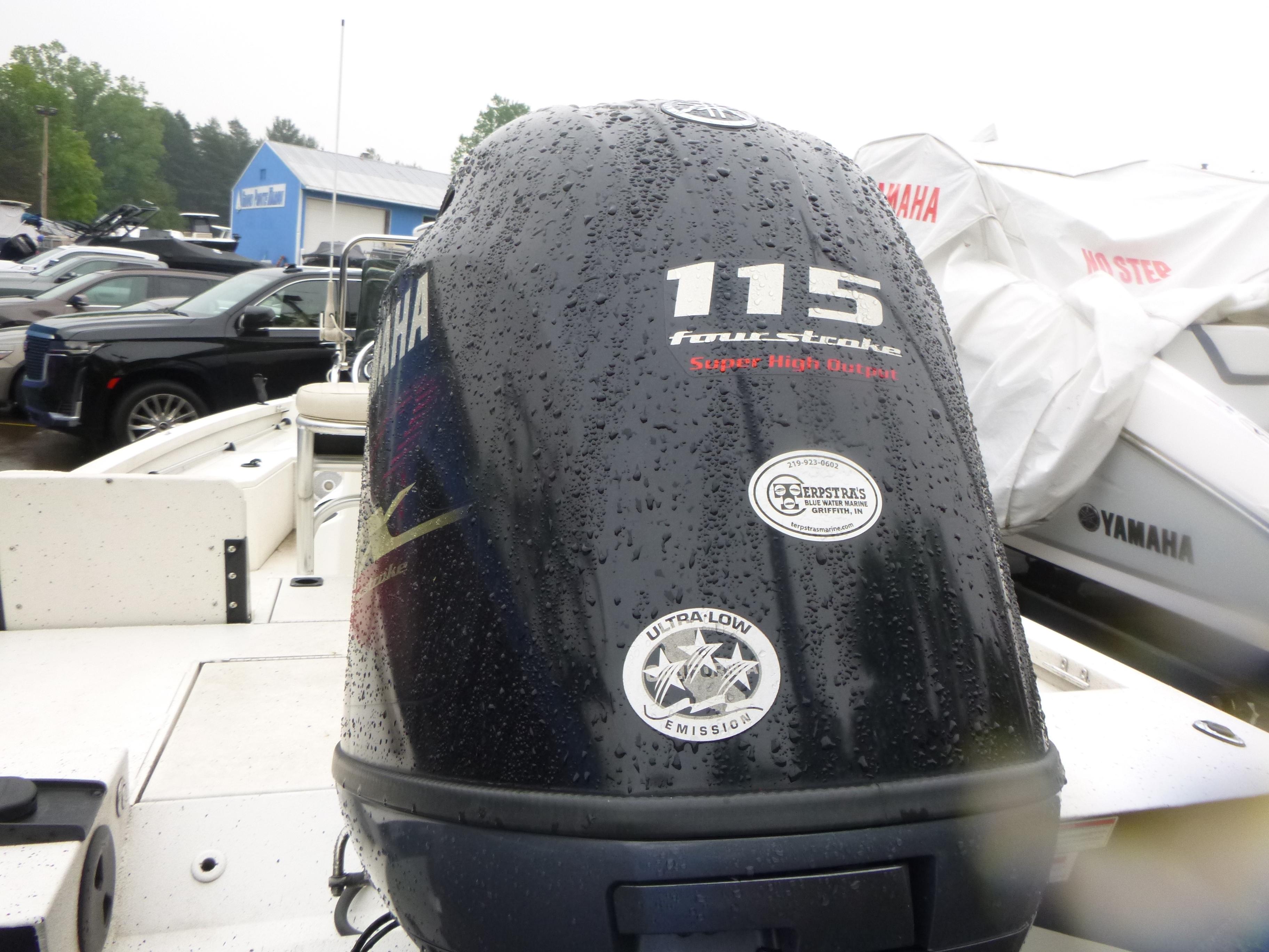 2017 G3 Bay 18 DLX boat with Yamaha 115 four-stroke engine in a marina.