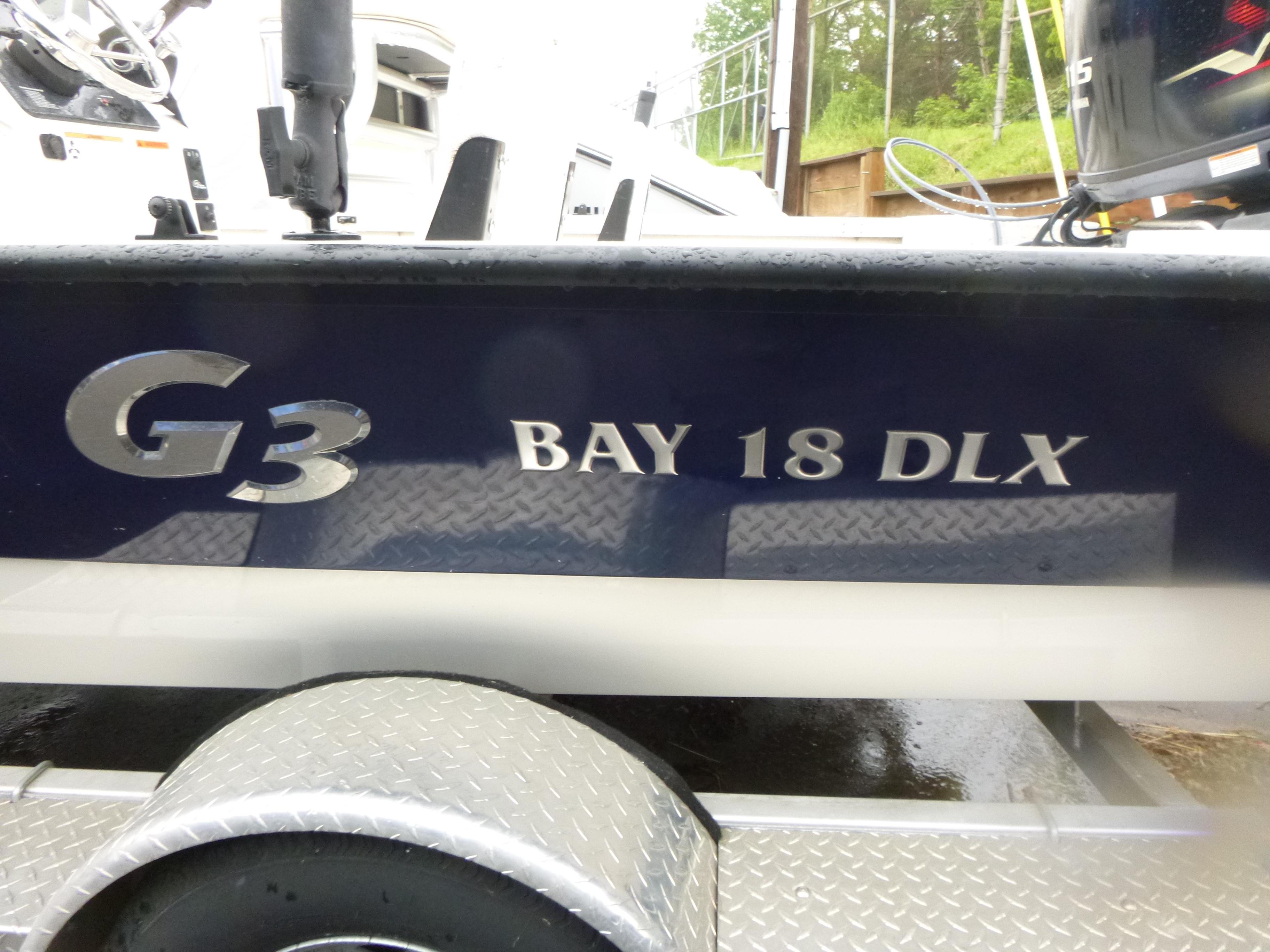 2017 G3 Bay 18 DLX boat on trailer, side view with logo.