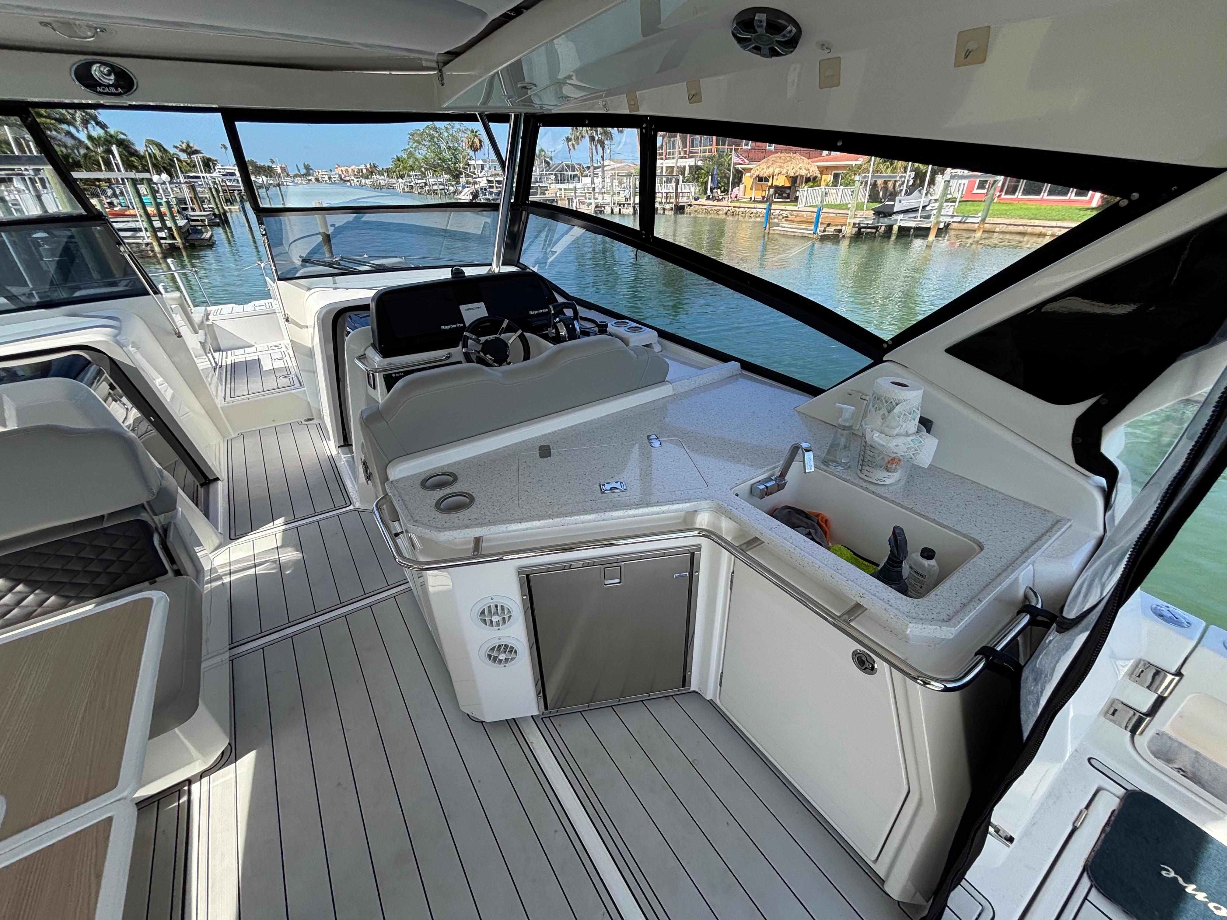 Aquila-36 Sport 2018-Namaste FL-US-Interior view of 2018 Aquila 36 Sport yacht with modern helm and kitchenette.-9848040 | Thumbnail