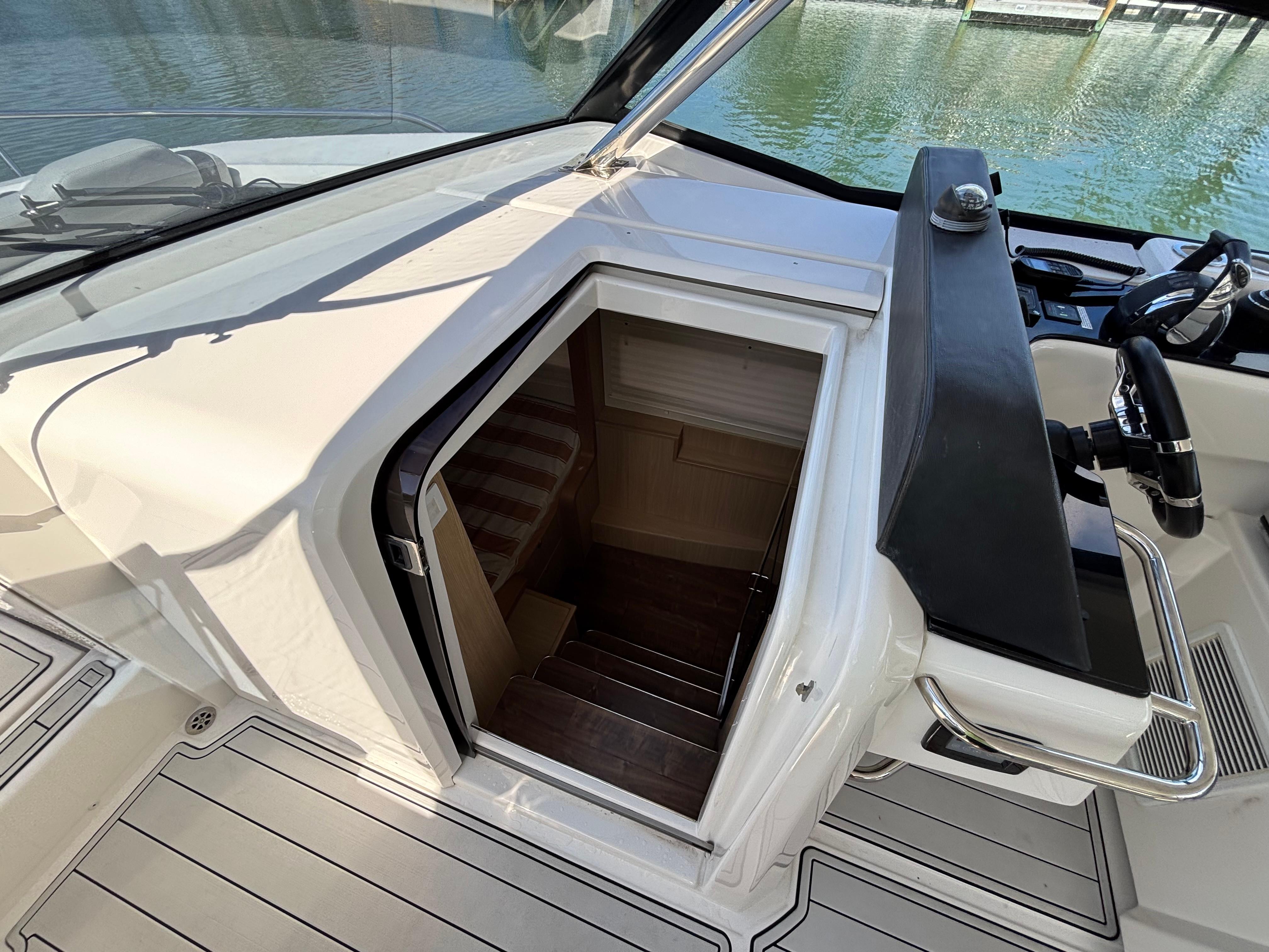 Aquila-36 Sport 2018-Namaste FL-US-Aquila 36 Sport 2018 boat interior entrance with stairs and steering wheel.-9848040 | Thumbnail