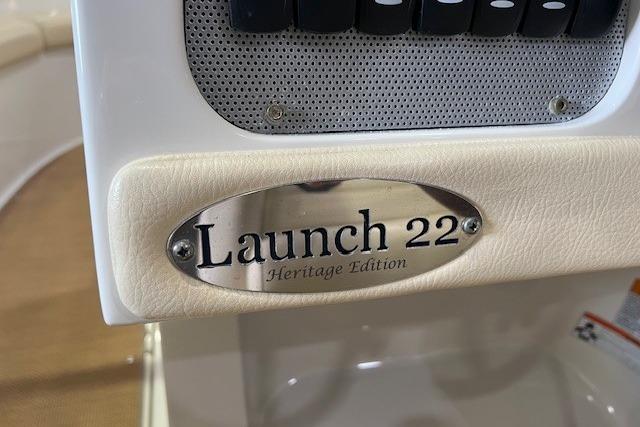 2011 Chris-Craft Launch 22 Heritage Edition nameplate on boat dashboard.