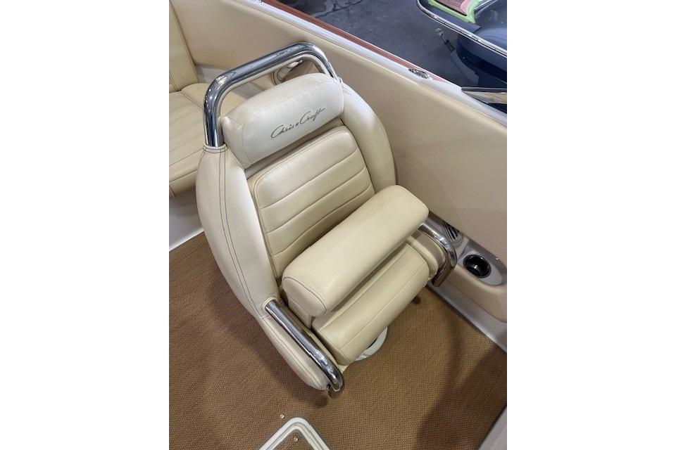 Luxurious beige seat in 2011 Chris-Craft Launch 22 boat with chrome accents.