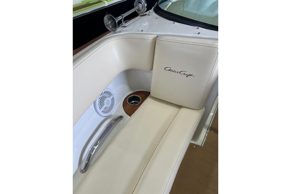 2011 Chris-Craft Launch 22 boat interior with beige seating and branded logo.