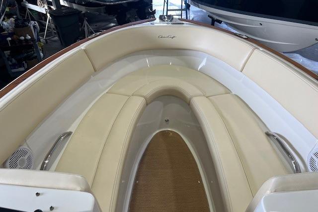 2011 Chris-Craft Launch 22 boat interior with beige seating and elegant design.