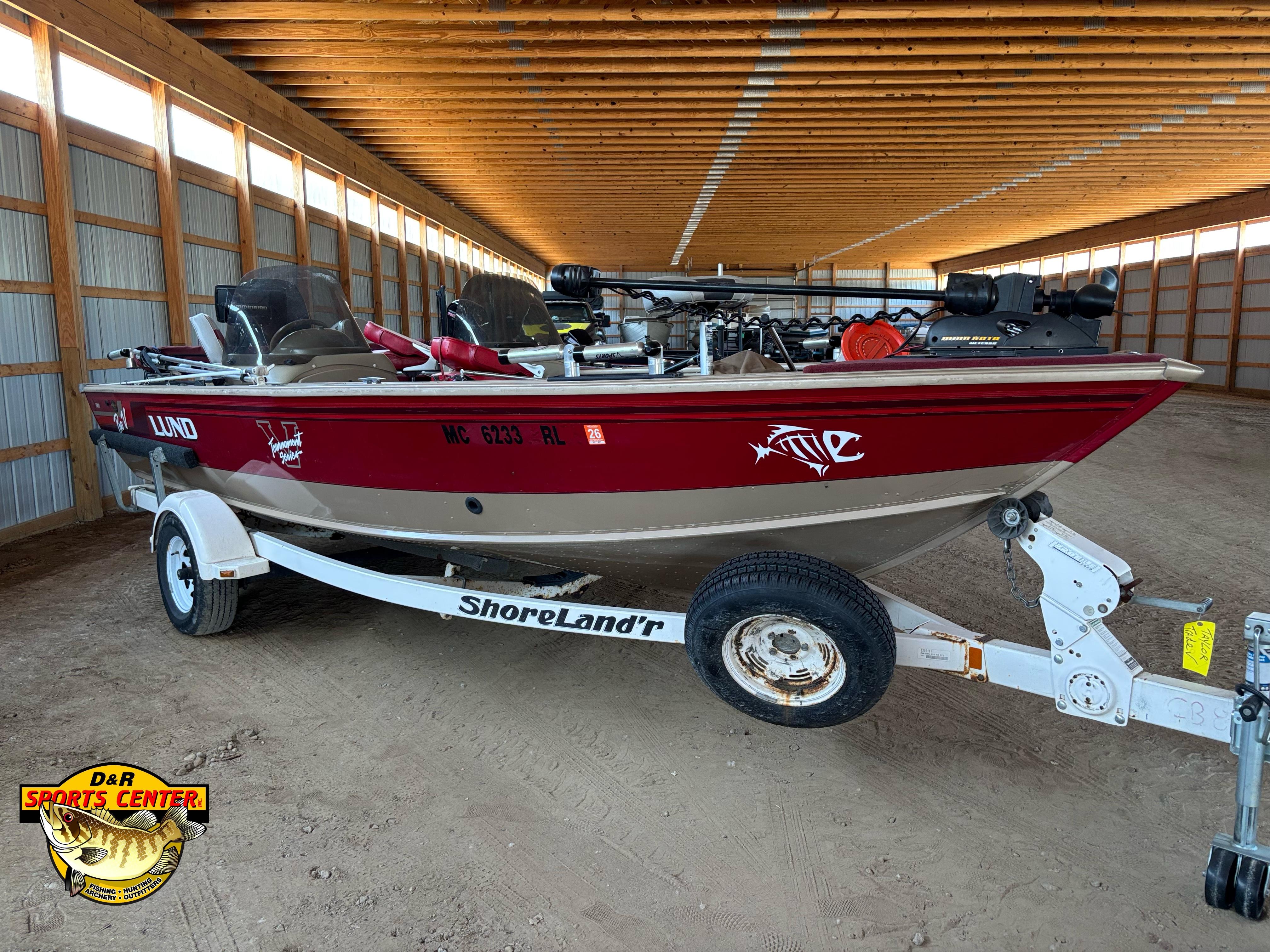1997 Lund 1900 Pro-V LE fishing boat on ShoreLand'r trailer in storage facility.