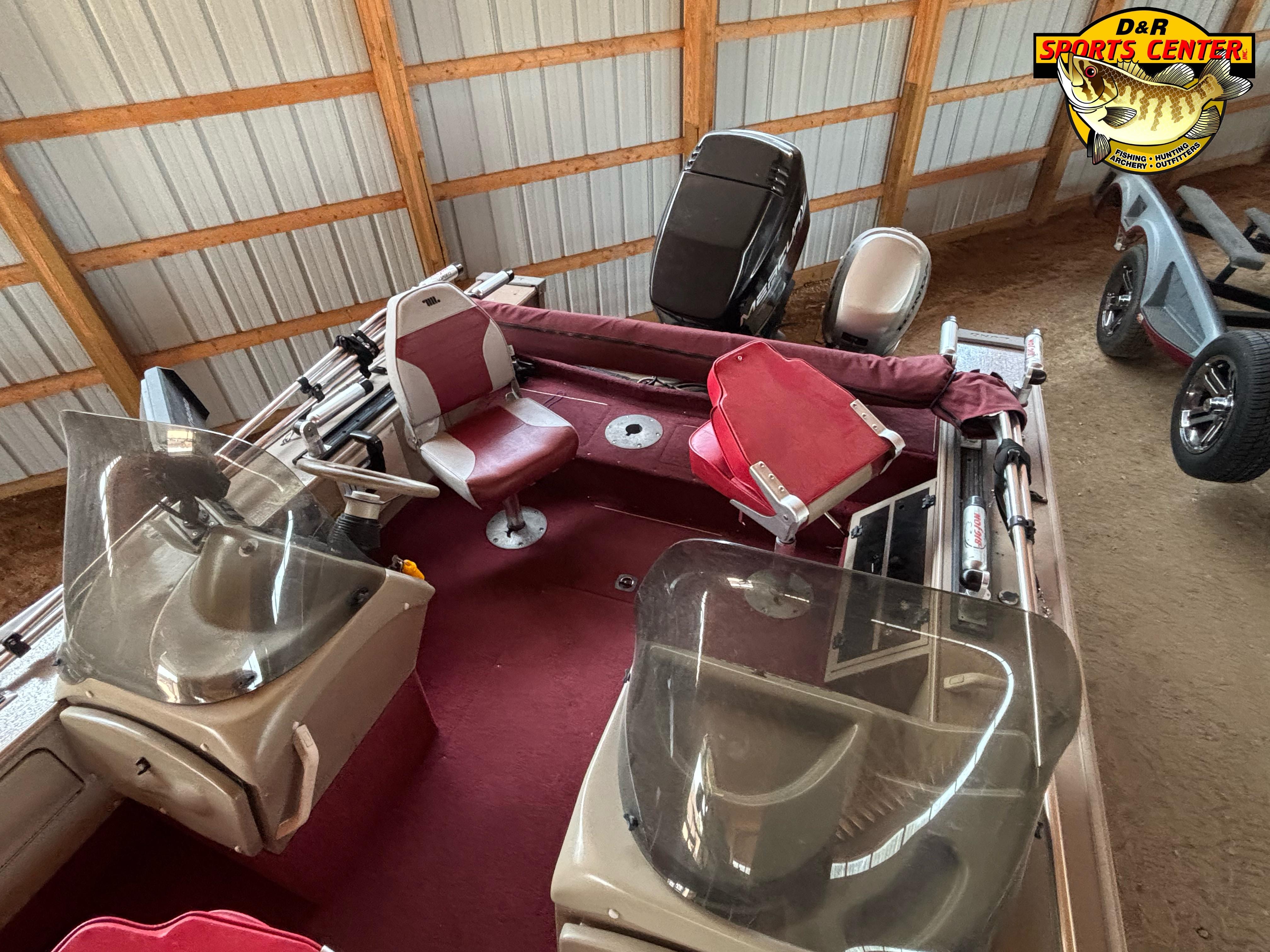1997 Lund 1900 Pro-V LE boat with red interior, stored indoors.