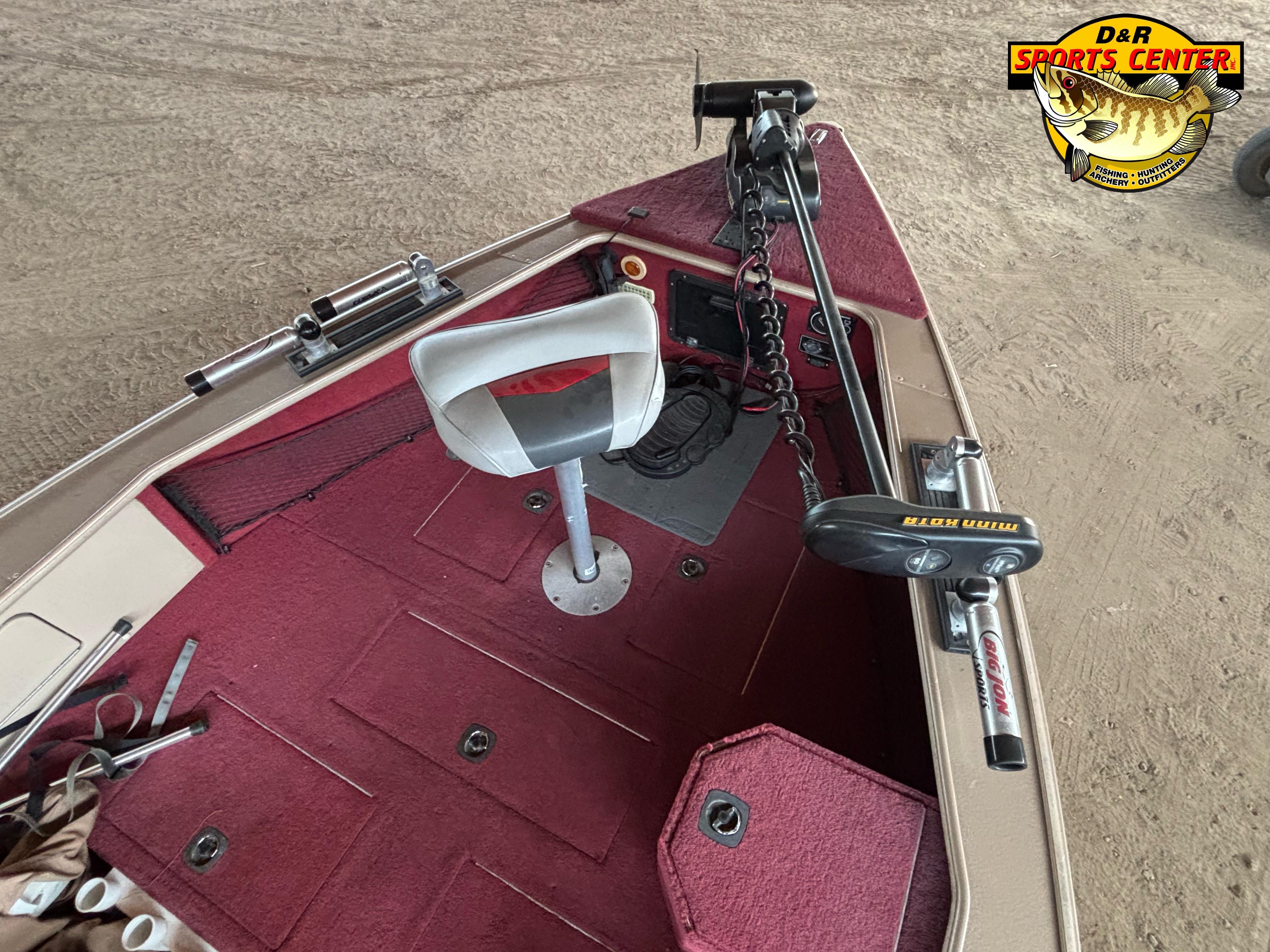 1997 Lund 1900 Pro-V LE boat interior with red carpet and fishing equipment.