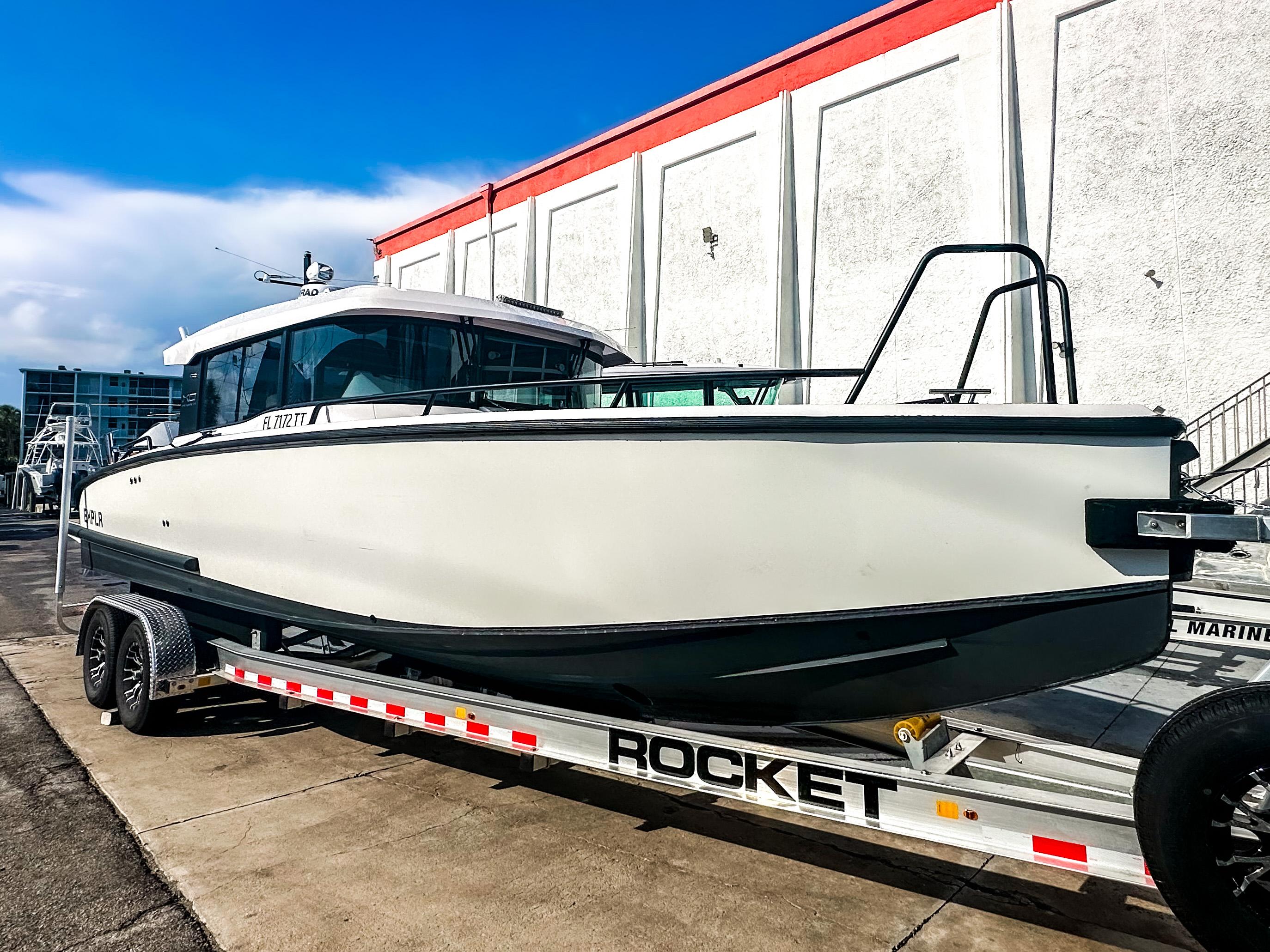 XO Boats-EXPLR 10 Sport Plus 2024 -FL-US-2024 XO Boats EXPLR 10 Sport Plus on trailer, parked outdoors.-9818089