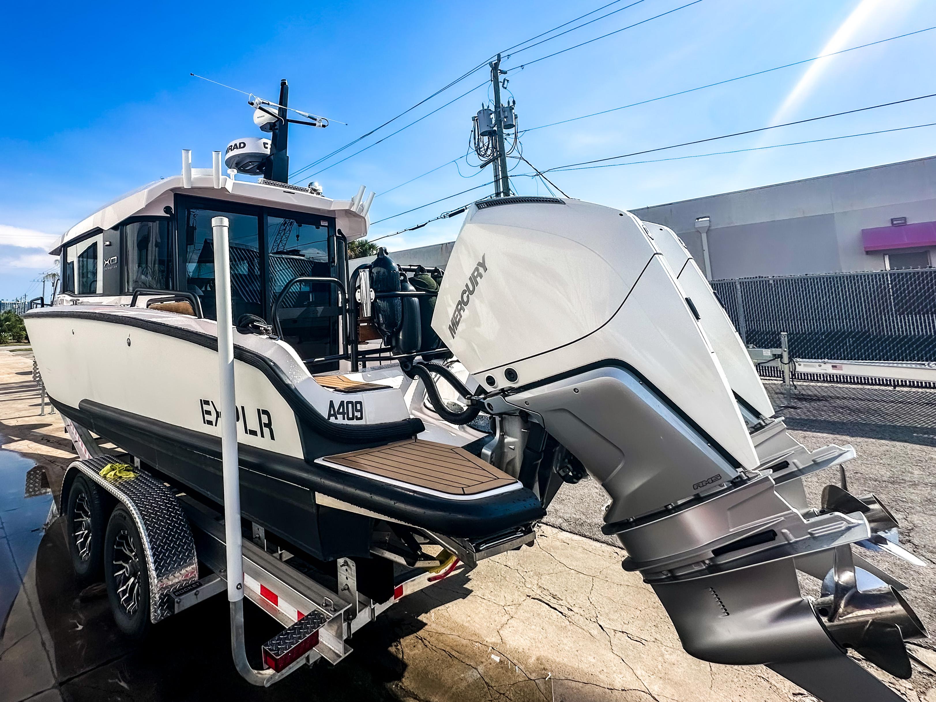 XO Boats-EXPLR 10 Sport Plus 2024 -FL-US-2024 XO Boats EXPLR 10 Sport Plus on trailer, showcasing powerful outboard motor.-9818089 | Thumbnail