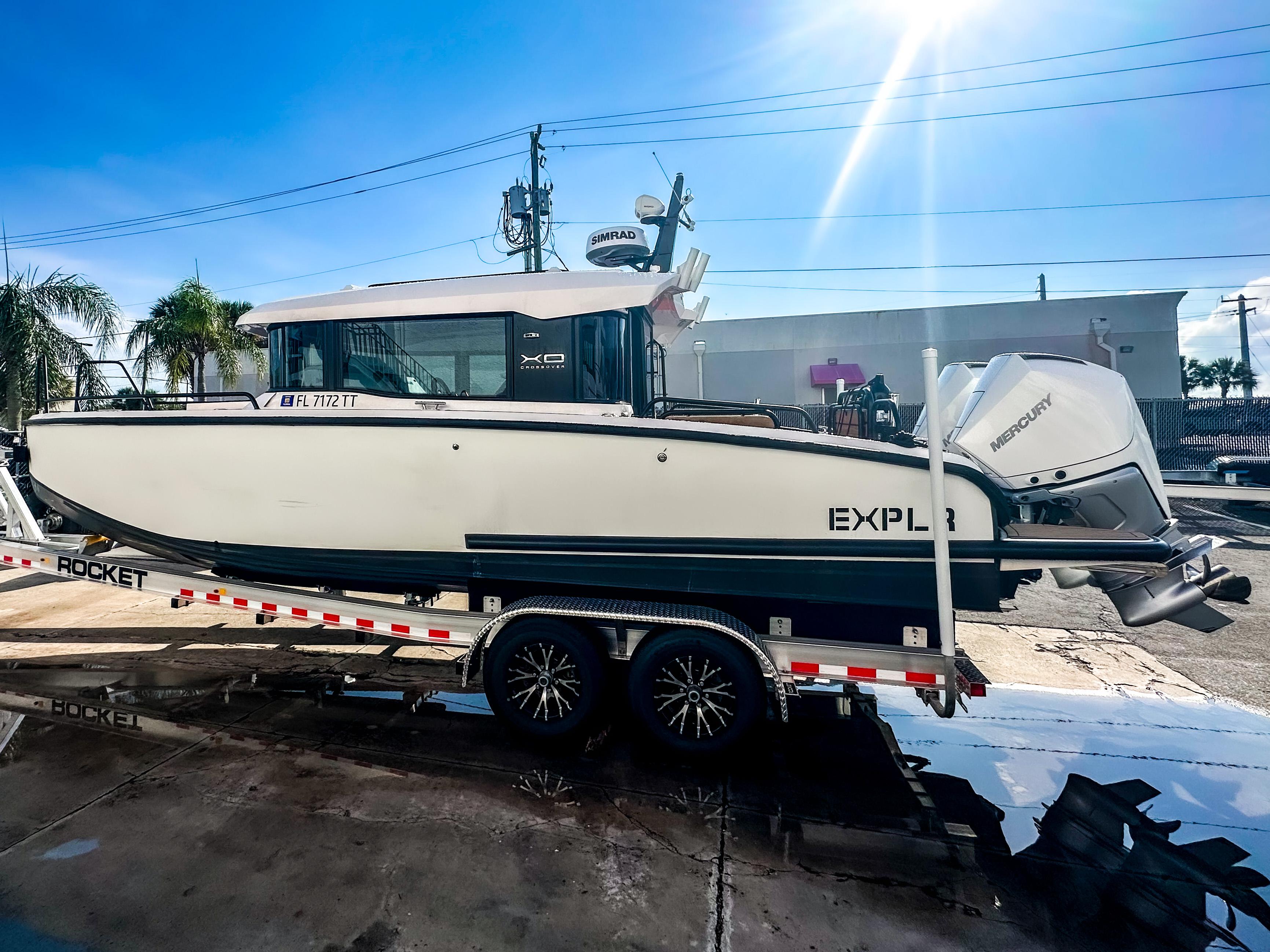XO Boats-EXPLR 10 Sport Plus 2024 -FL-US-2024 XO Boats EXPLR 10 Sport Plus on trailer under bright sunlight.-9818089 | Thumbnail