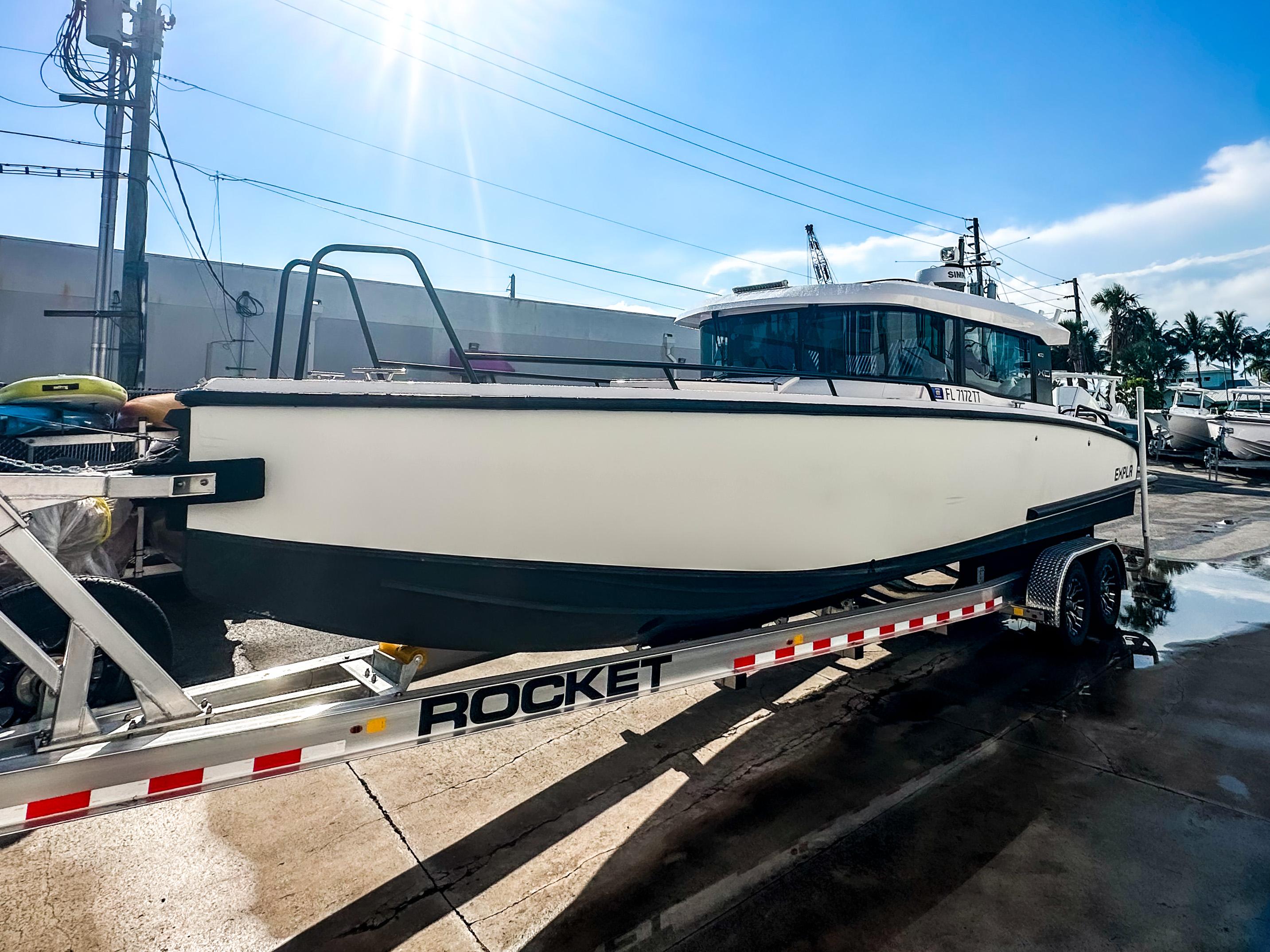 XO Boats-EXPLR 10 Sport Plus 2024 -FL-US-2024 XO Boats EXPLR 10 Sport Plus on trailer under bright sunlight.-9818089 | Thumbnail