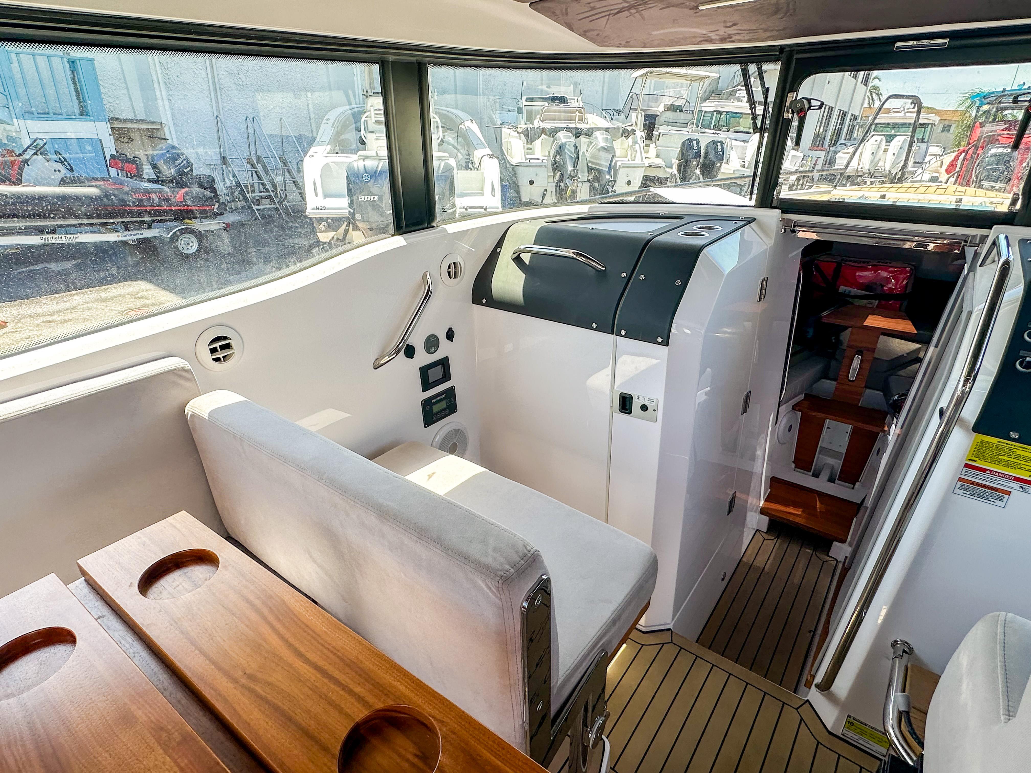 XO Boats-EXPLR 10 Sport Plus 2024 -FL-US-2024 XO Boats EXPLR 10 Sport Plus interior with seating and control panel.-9818089 | Thumbnail
