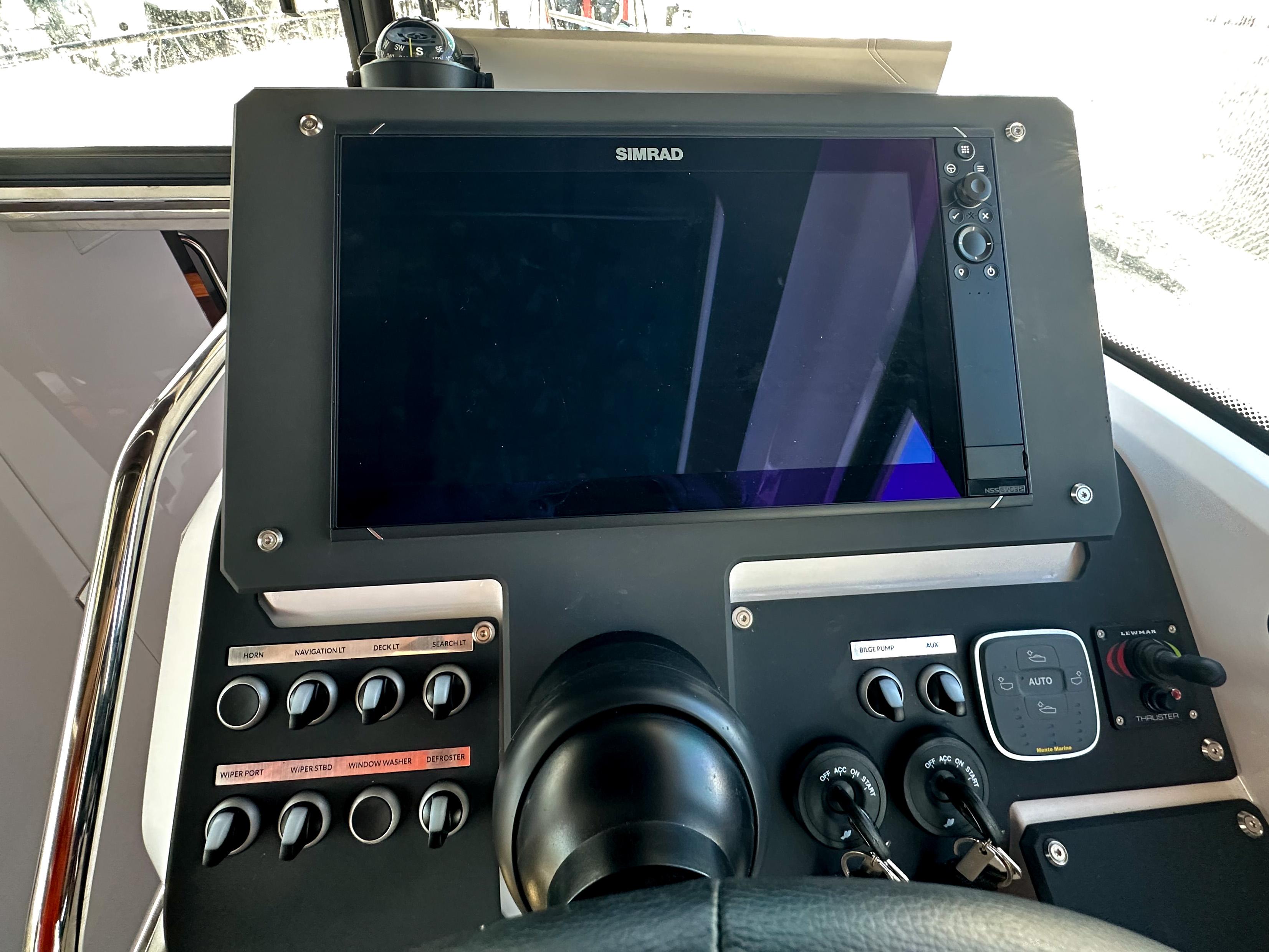 XO Boats-EXPLR 10 Sport Plus 2024 -FL-US-2024 XO Boats EXPLR 10 Sport Plus dashboard with Simrad display and control panel.-9818089 | Thumbnail