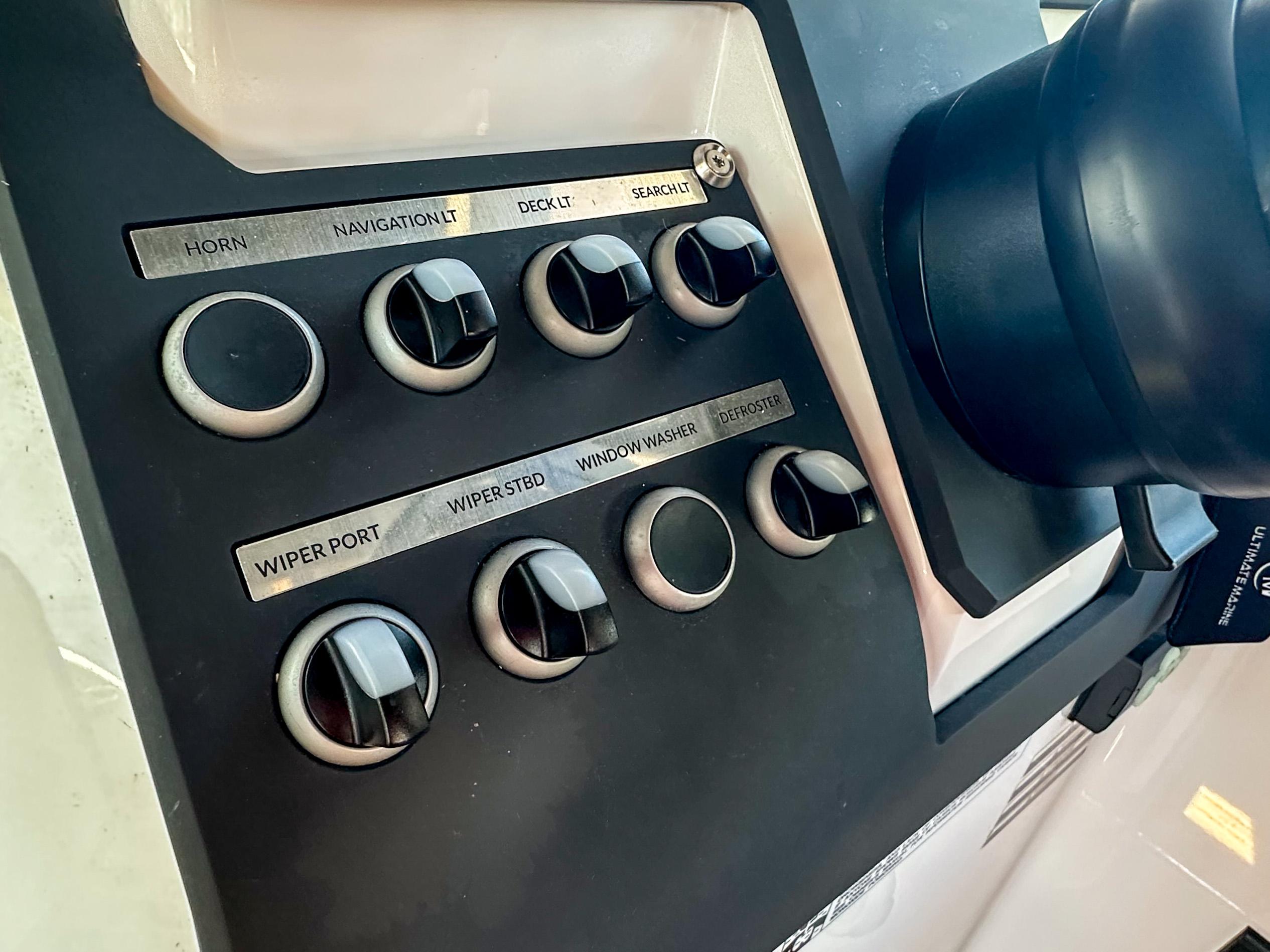 XO Boats-EXPLR 10 Sport Plus 2024 -FL-US-Control panel of 2024 XO Boats EXPLR 10 Sport Plus, featuring various switches and knobs.-9818089 | Thumbnail