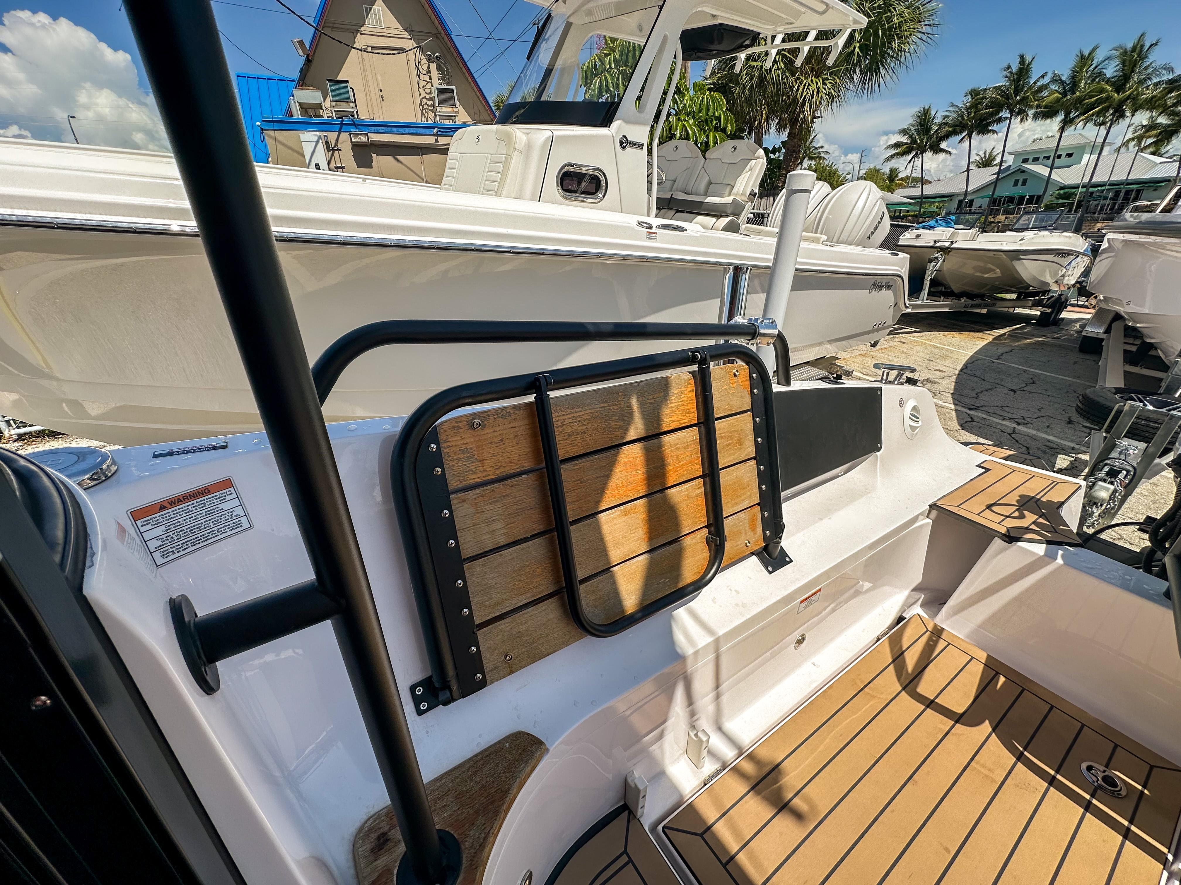XO Boats-EXPLR 10 Sport Plus 2024 -FL-US-2024 XO Boats EXPLR 10 Sport Plus interior with wooden deck and seating area.-9818089 | Thumbnail
