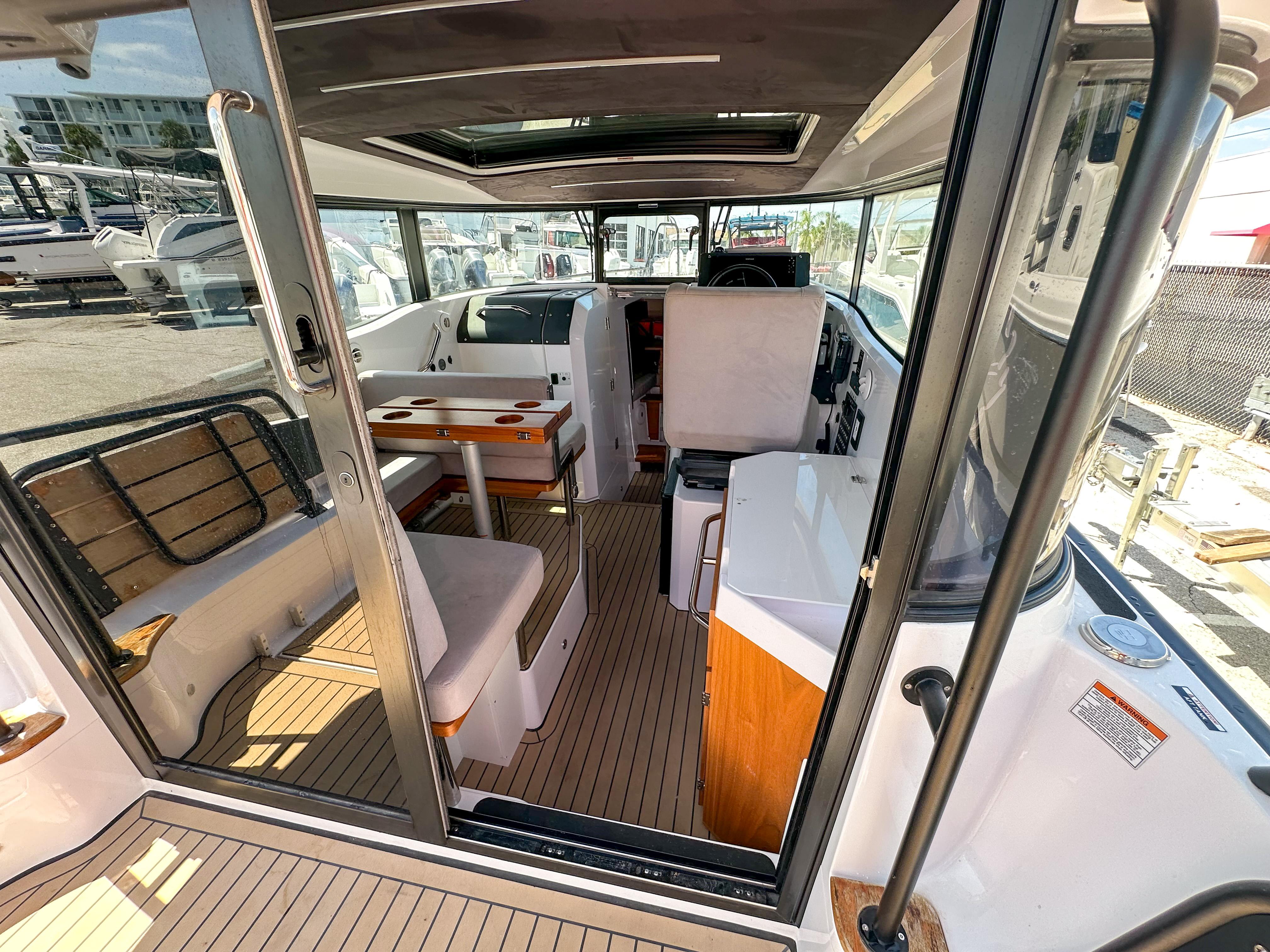 XO Boats-EXPLR 10 Sport Plus 2024 -FL-US-2024 XO Boats EXPLR 10 Sport Plus interior with seating and navigation area.-9818089 | Thumbnail