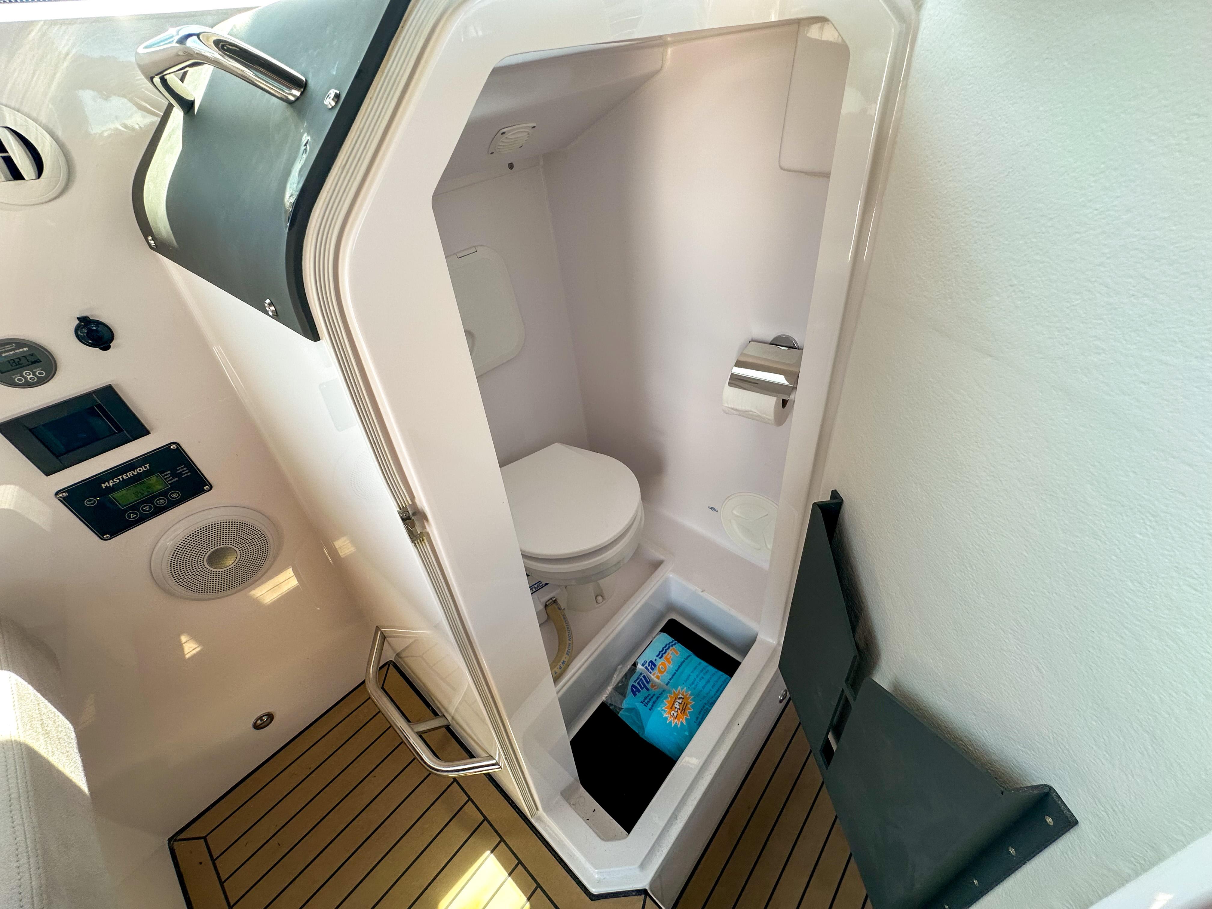 XO Boats-EXPLR 10 Sport Plus 2024 -FL-US-2024 XO Boats EXPLR 10 Sport Plus interior bathroom with modern amenities and wooden flooring.-9818089 | Thumbnail