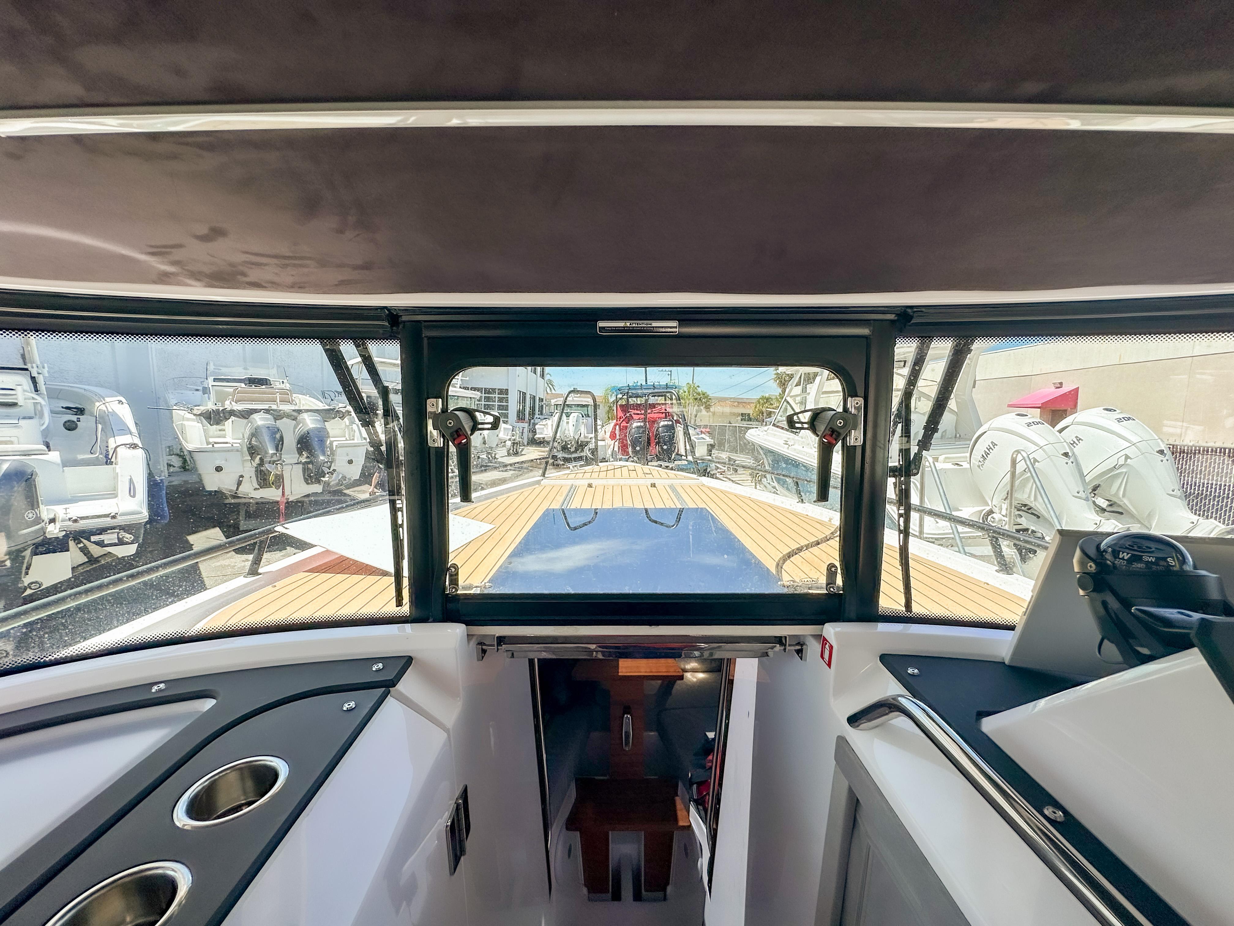 XO Boats-EXPLR 10 Sport Plus 2024 -FL-US-2024 XO Boats EXPLR 10 Sport Plus interior view with modern dashboard and outdoor deck.-9818089 | Thumbnail