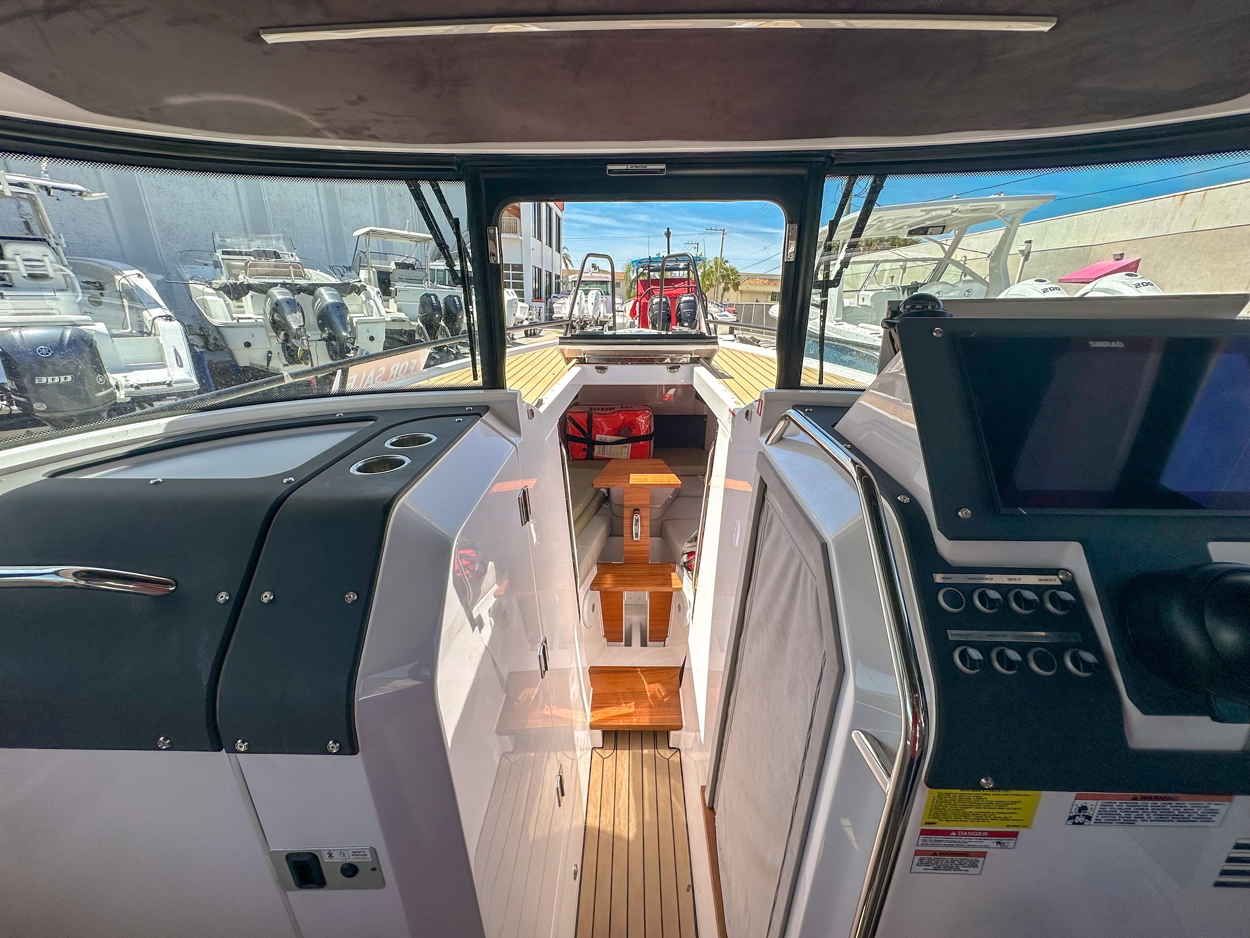 XO Boats-EXPLR 10 Sport Plus 2024 -FL-US-2024 XO Boats EXPLR 10 Sport Plus interior with modern dashboard and wooden flooring.-9818089 | Thumbnail