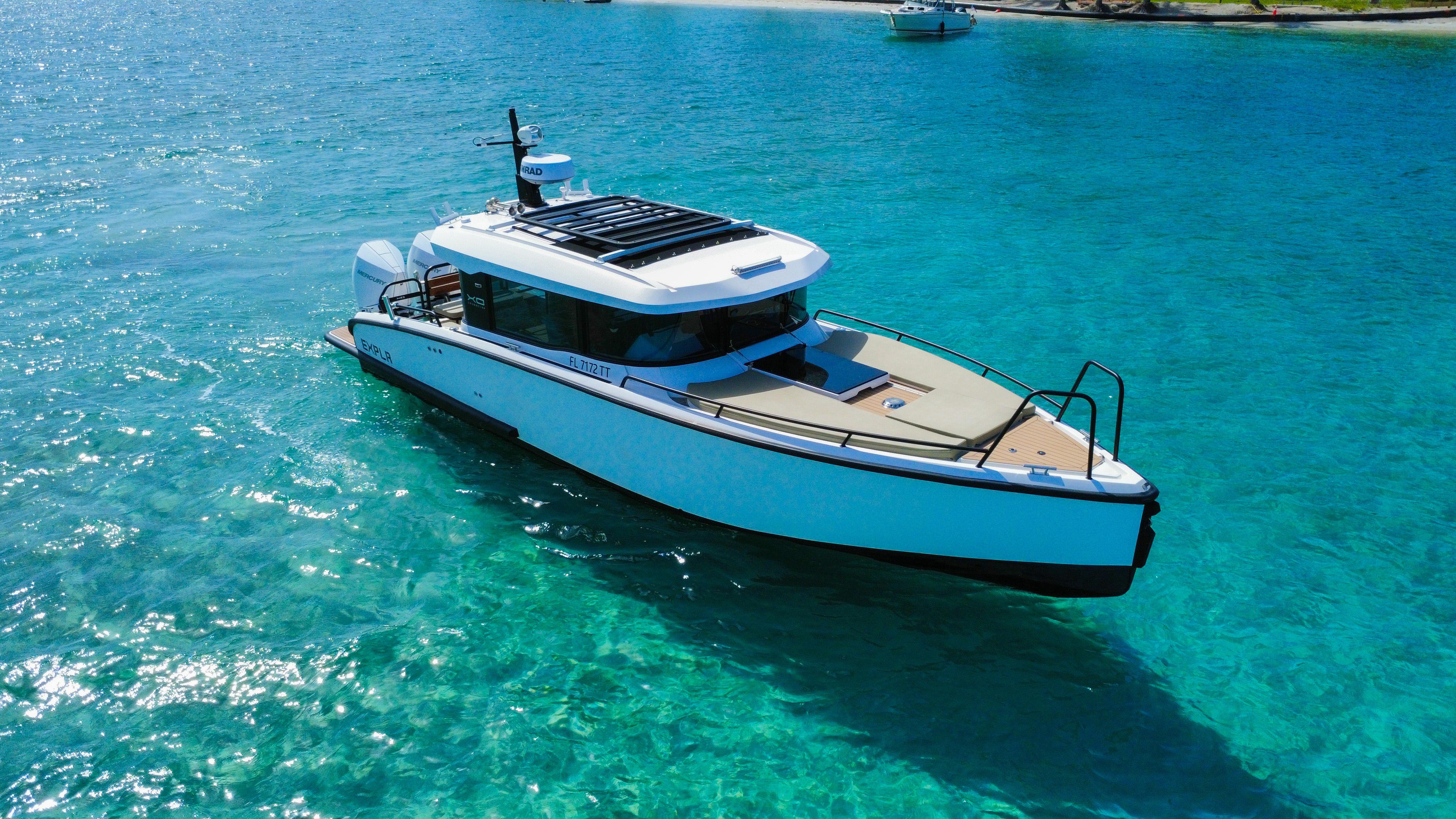 Picture of XO Boats 30.67 ft' XO Boats EXPLR 10S Plus 2024 XO Boats EXPLR 10S Plus cruising on clear turquoise waters. 