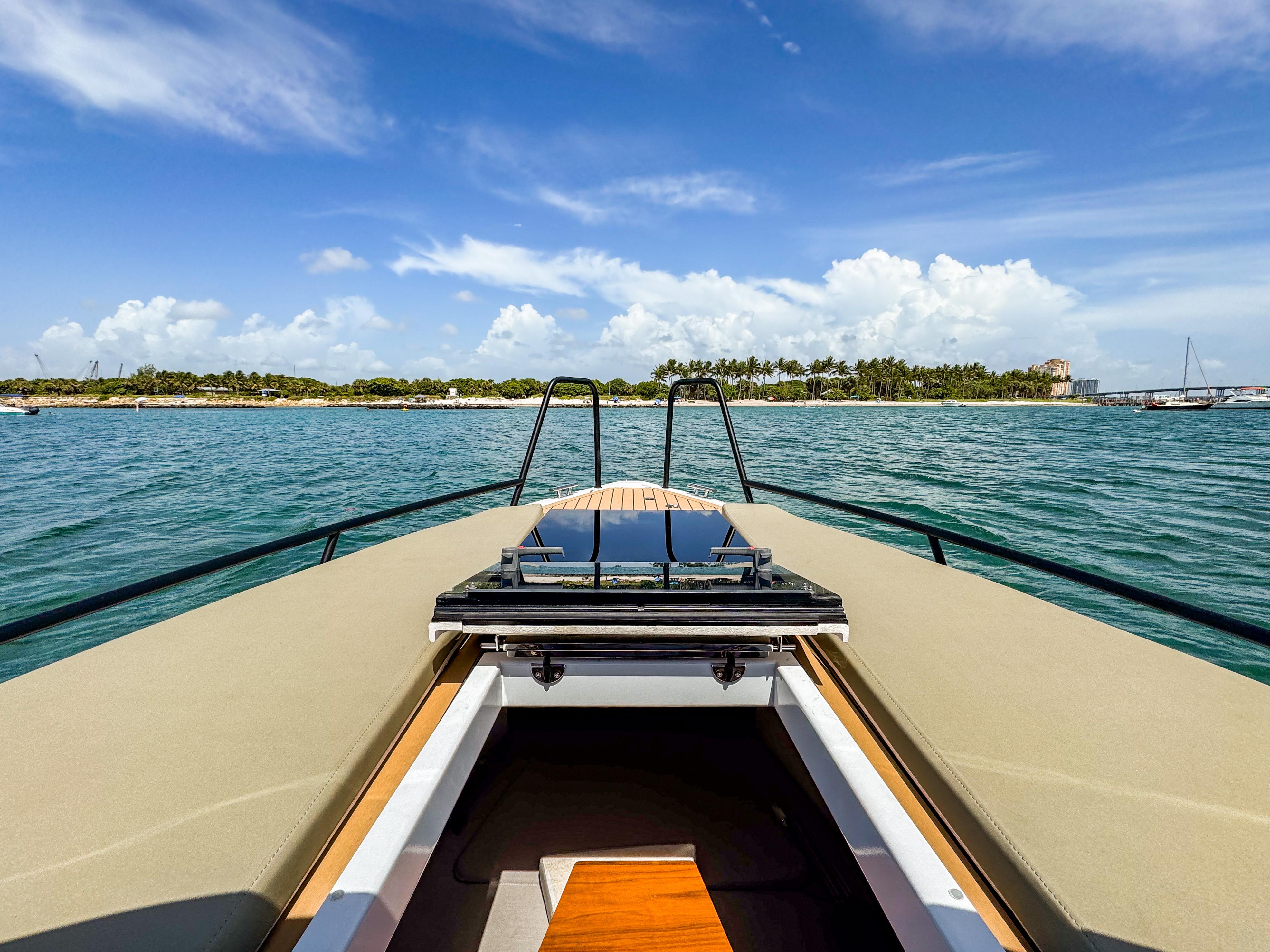 XO Boats-XO Boats EXPLR 10S Plus 2024 -FL-US-2024 XO Boats EXPLR 10S Plus cruising on a sunny day with scenic island view.-9818089 | Thumbnail