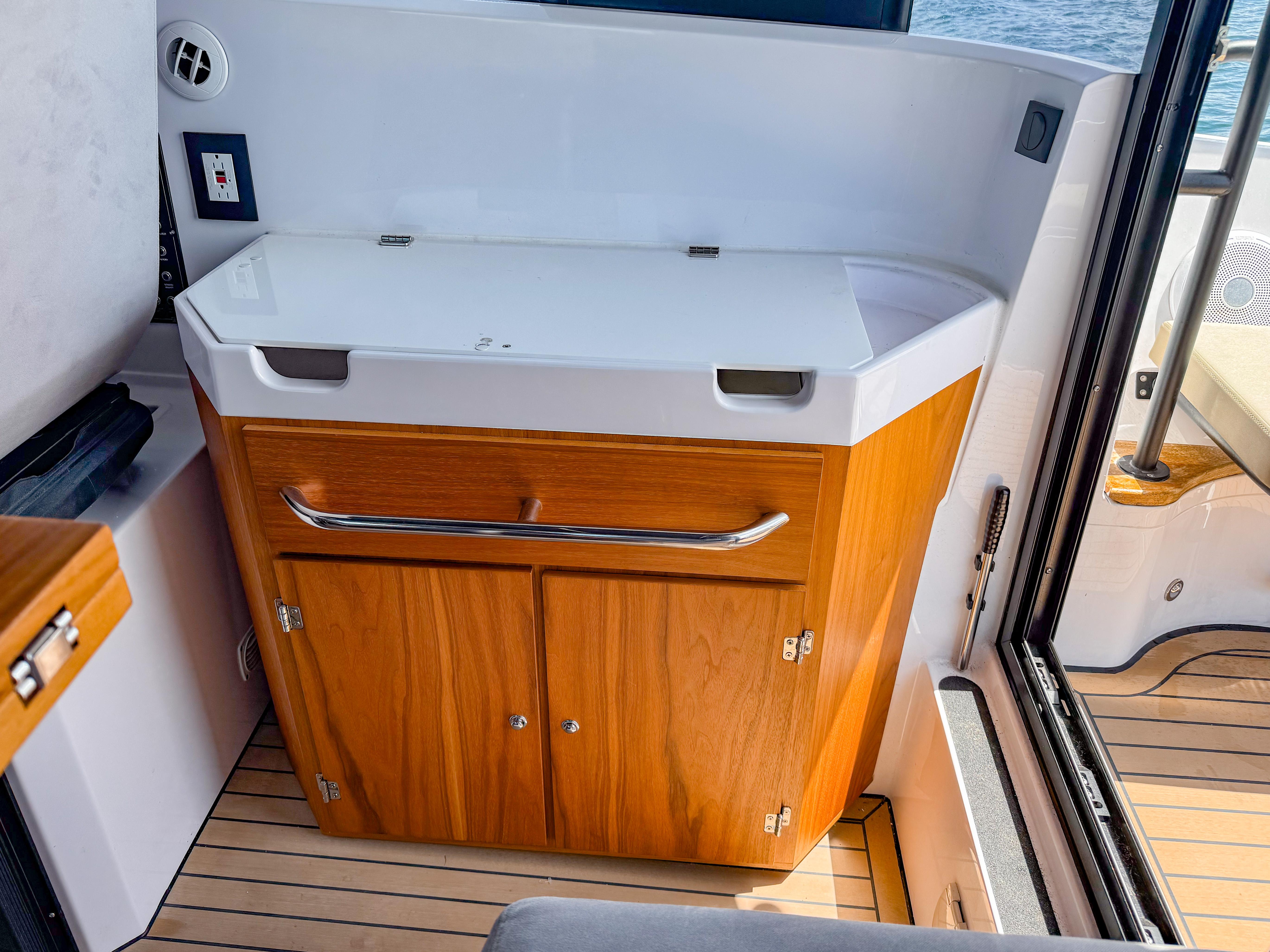 XO Boats-XO Boats EXPLR 10S Plus 2024 -FL-US-2024 XO Boats EXPLR 10S Plus interior with wooden cabinetry and sleek design.-9818089 | Thumbnail