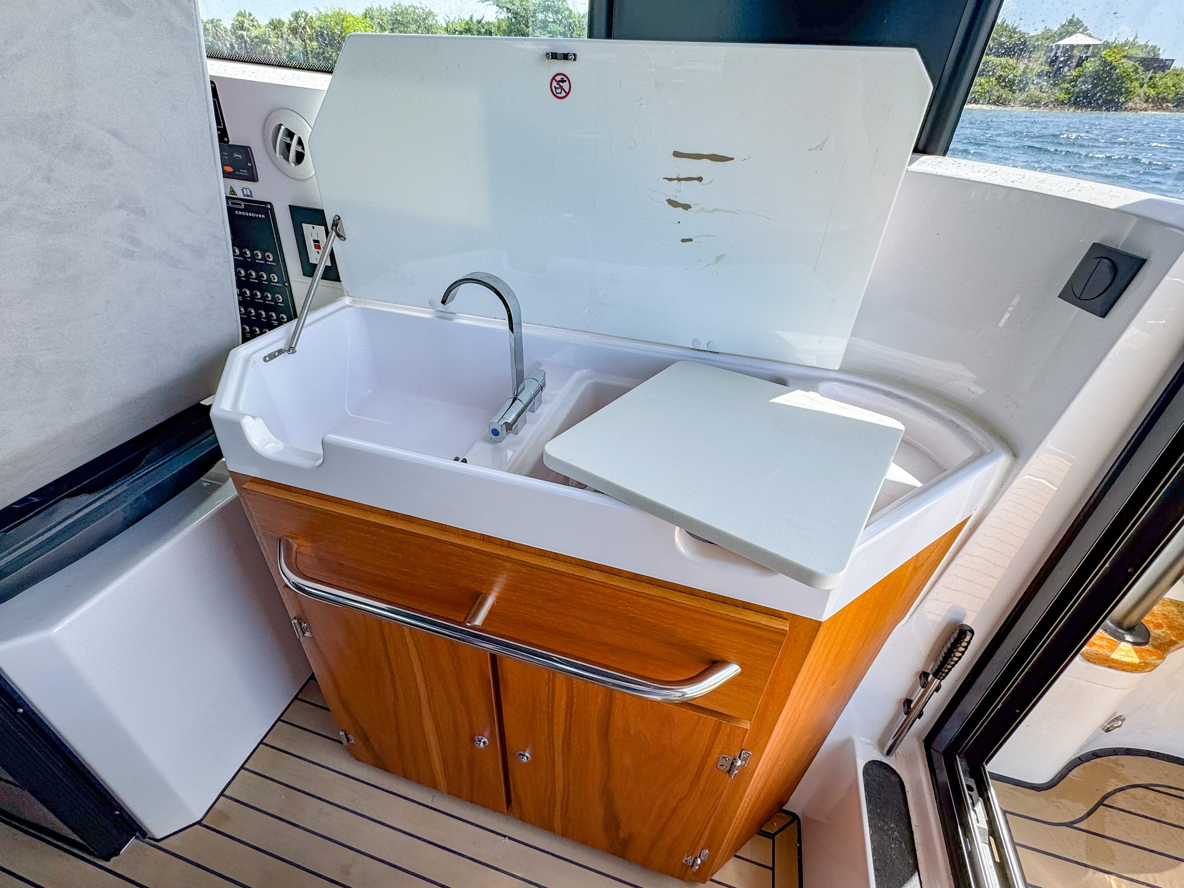 XO Boats-XO Boats EXPLR 10S Plus 2024 -FL-US-2024 XO Boats EXPLR 10S Plus interior sink with wooden cabinetry and modern design.-9818089 | Thumbnail