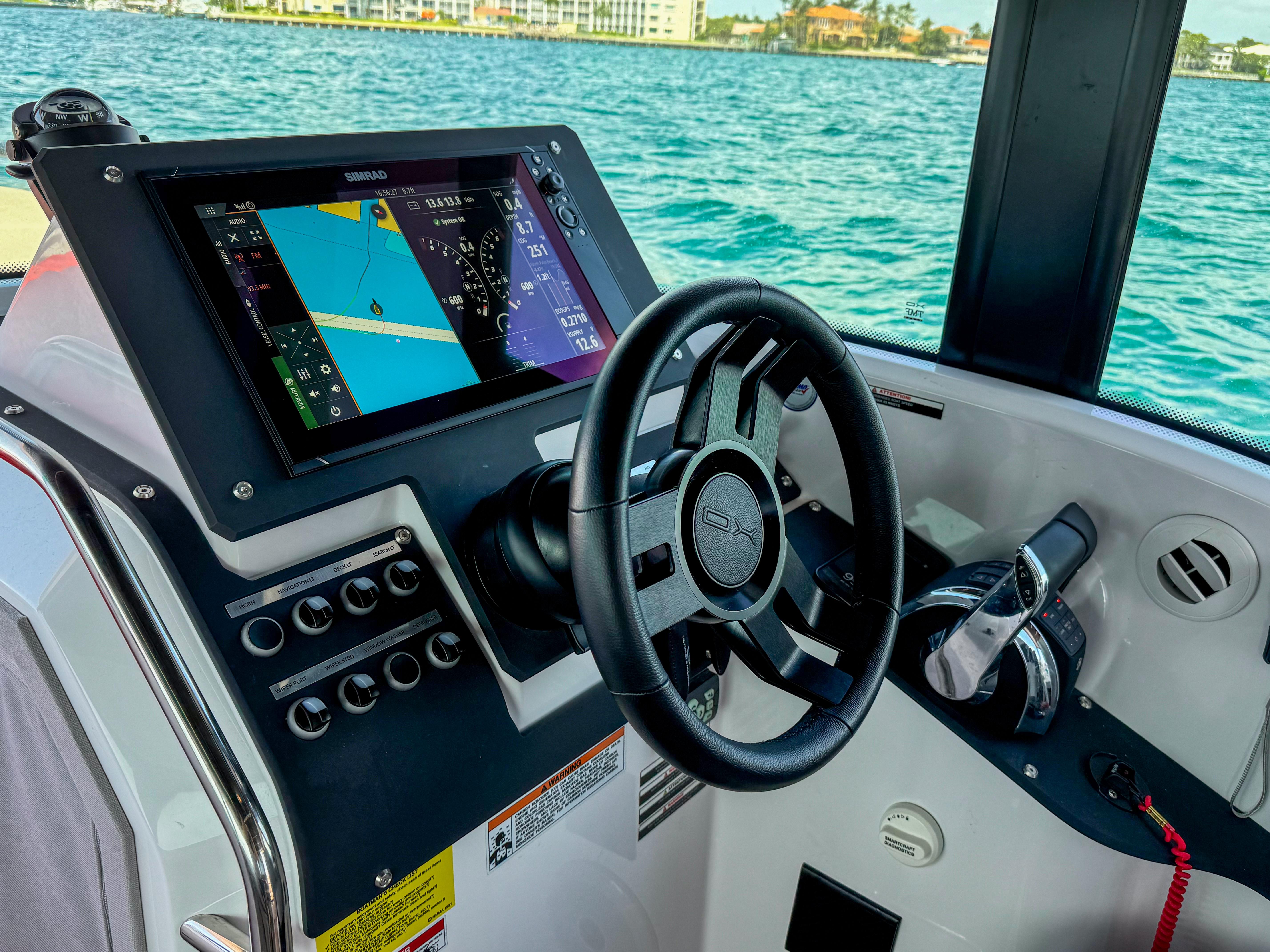 XO Boats-XO Boats EXPLR 10S Plus 2024 -FL-US-2024 XO Boats EXPLR 10S Plus cockpit with navigation display and steering wheel.-9818089 | Thumbnail