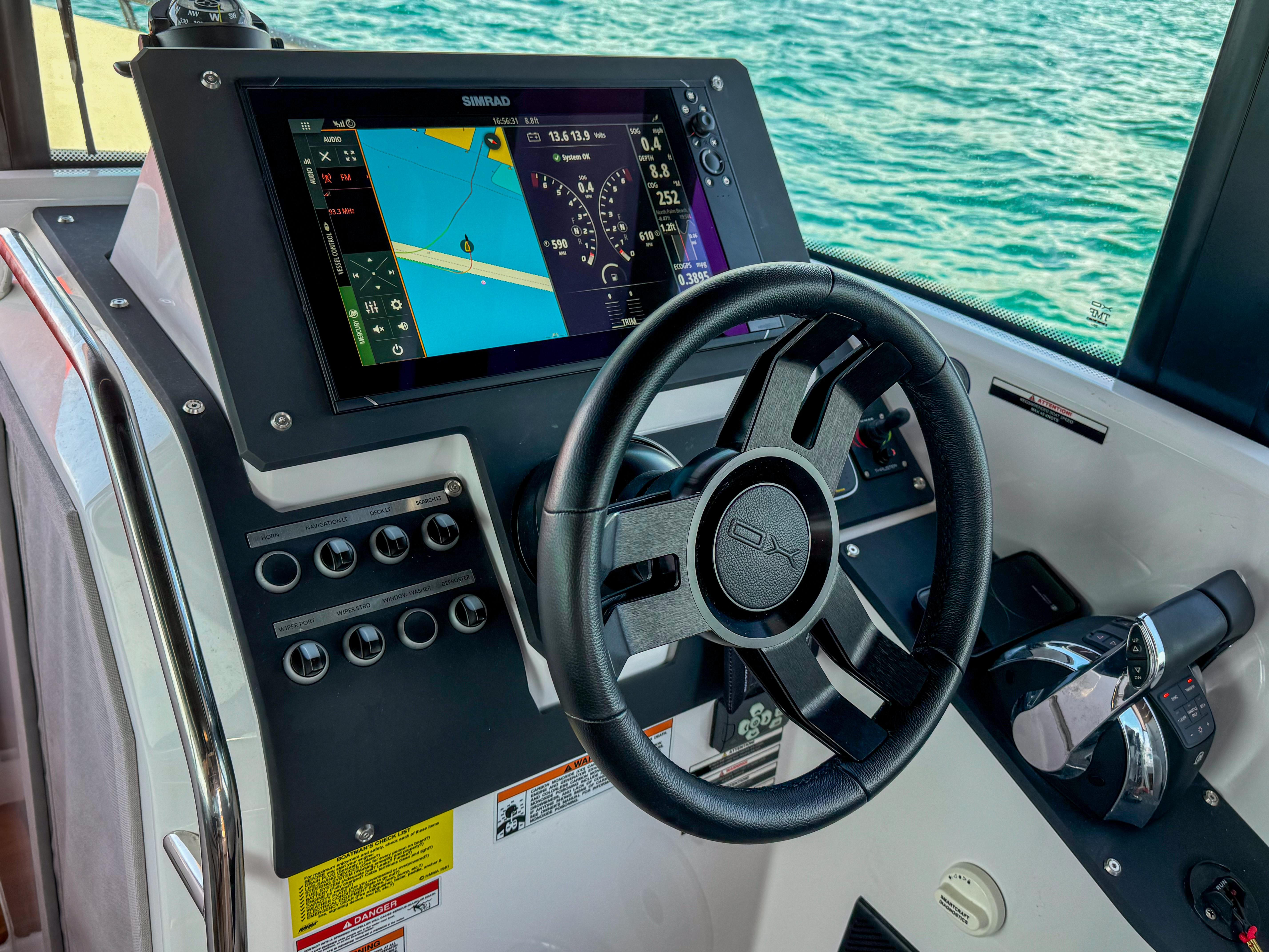 XO Boats-XO Boats EXPLR 10S Plus 2024 -FL-US-2024 XO Boats EXPLR 10S Plus helm with navigation display and steering wheel.-9818089 | Thumbnail