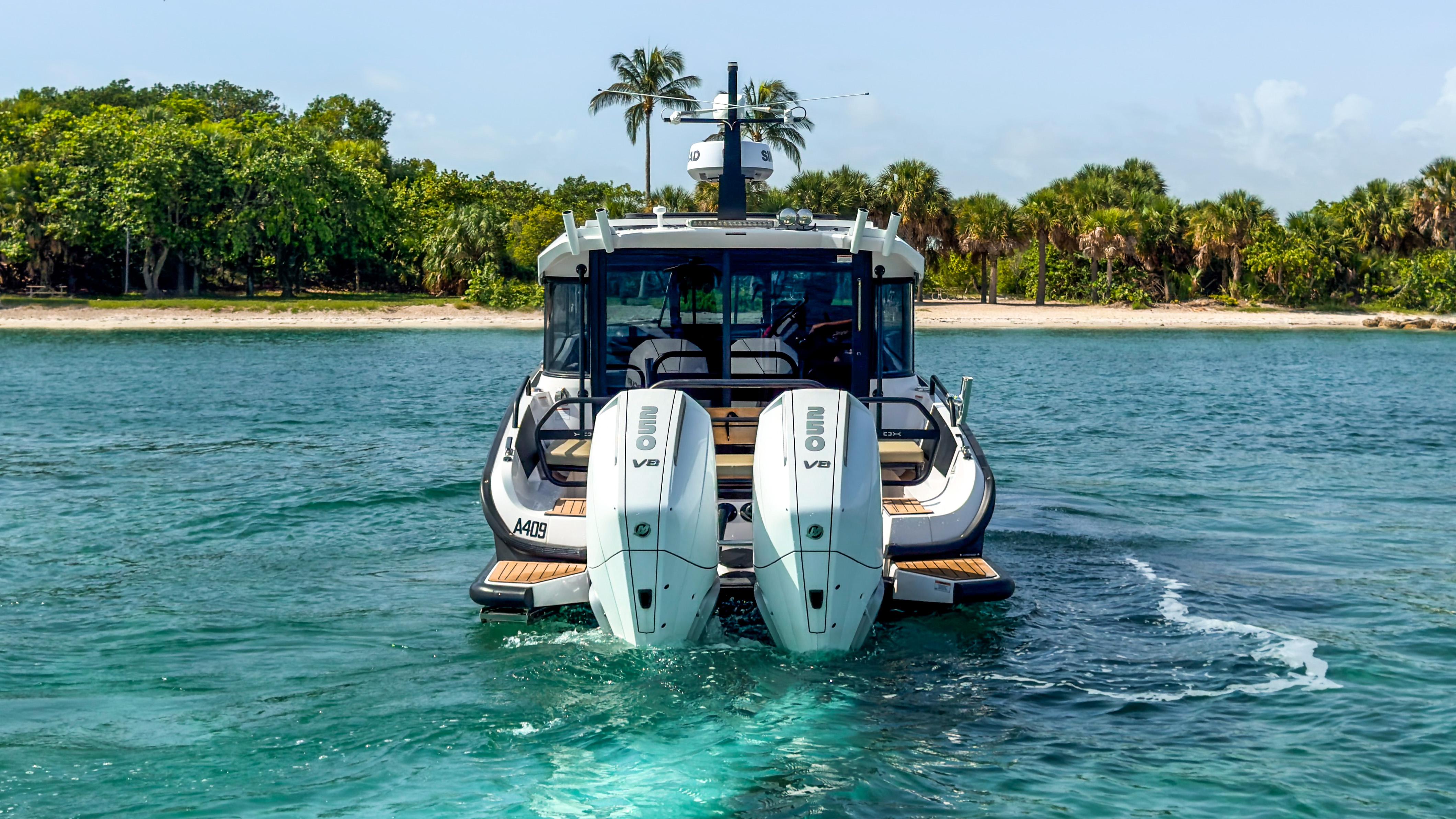 XO Boats-XO Boats EXPLR 10S Plus 2024 -FL-US-2024 XO Boats EXPLR 10S Plus cruising near a tropical shoreline.-9818089 | Thumbnail