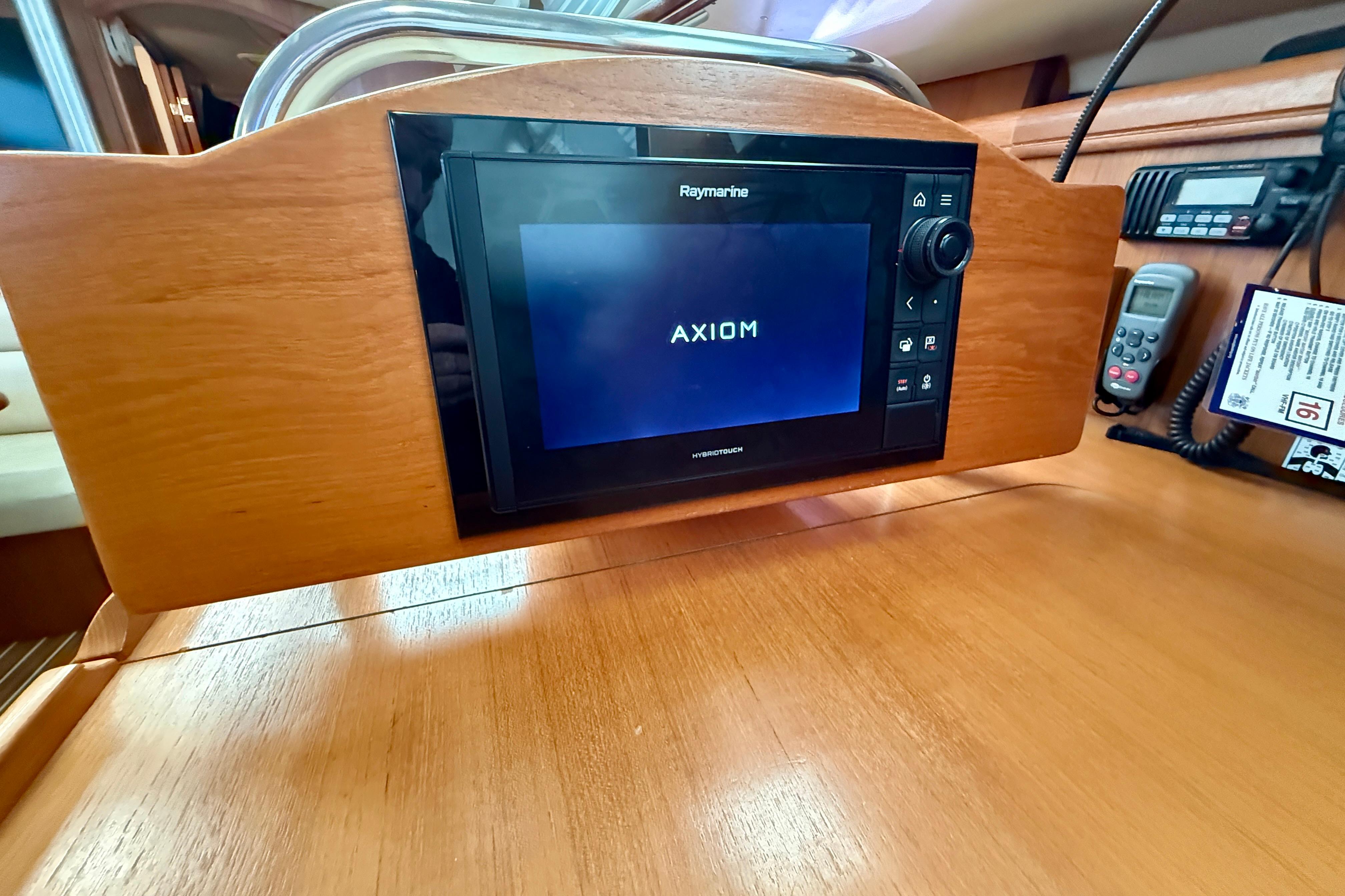 Raymarine Axiom display on 2007 Hunter 44 Deck Salon yacht's wooden dashboard.