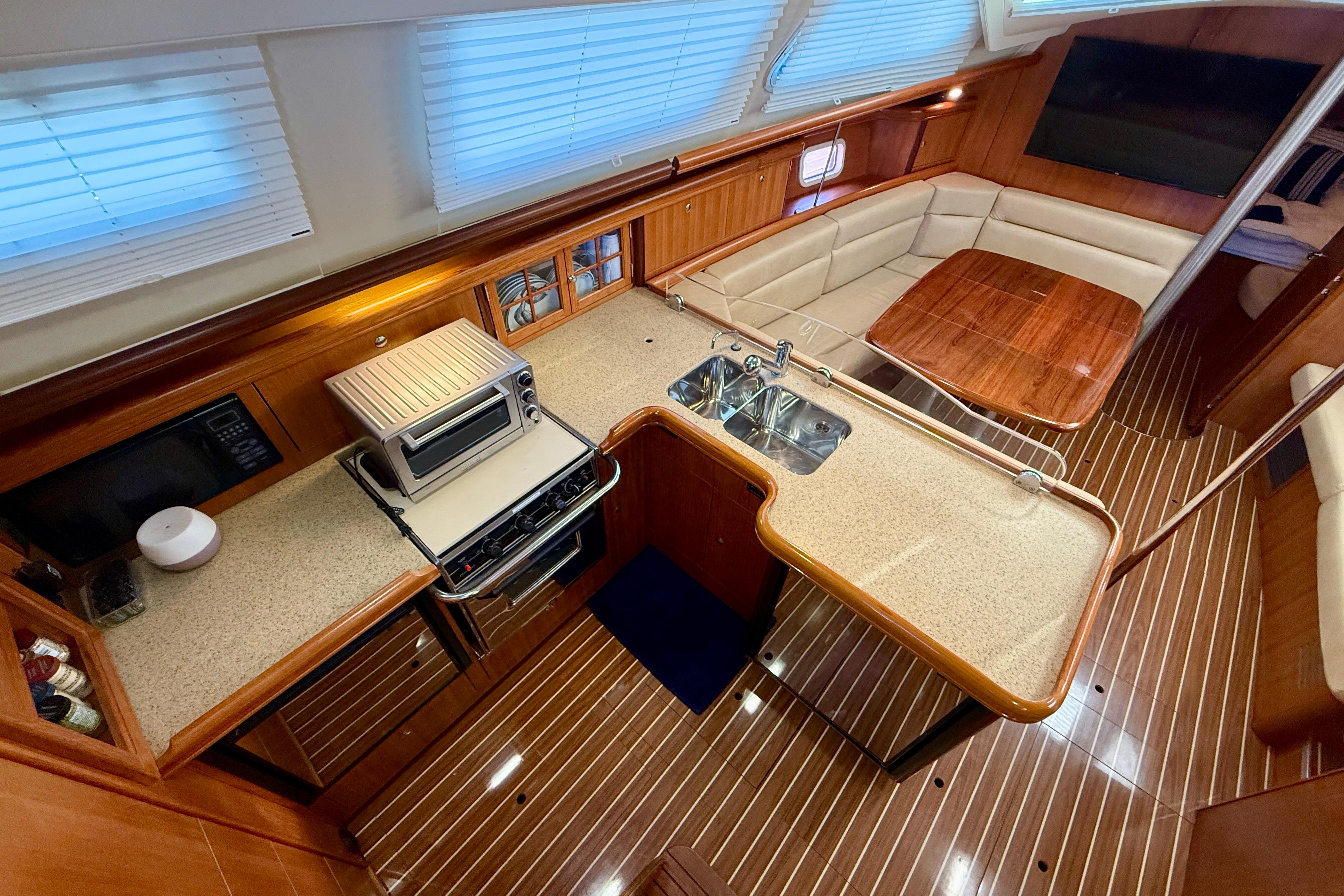 Luxurious 2007 Hunter 44 Deck Salon interior with modern kitchen and cozy seating area.