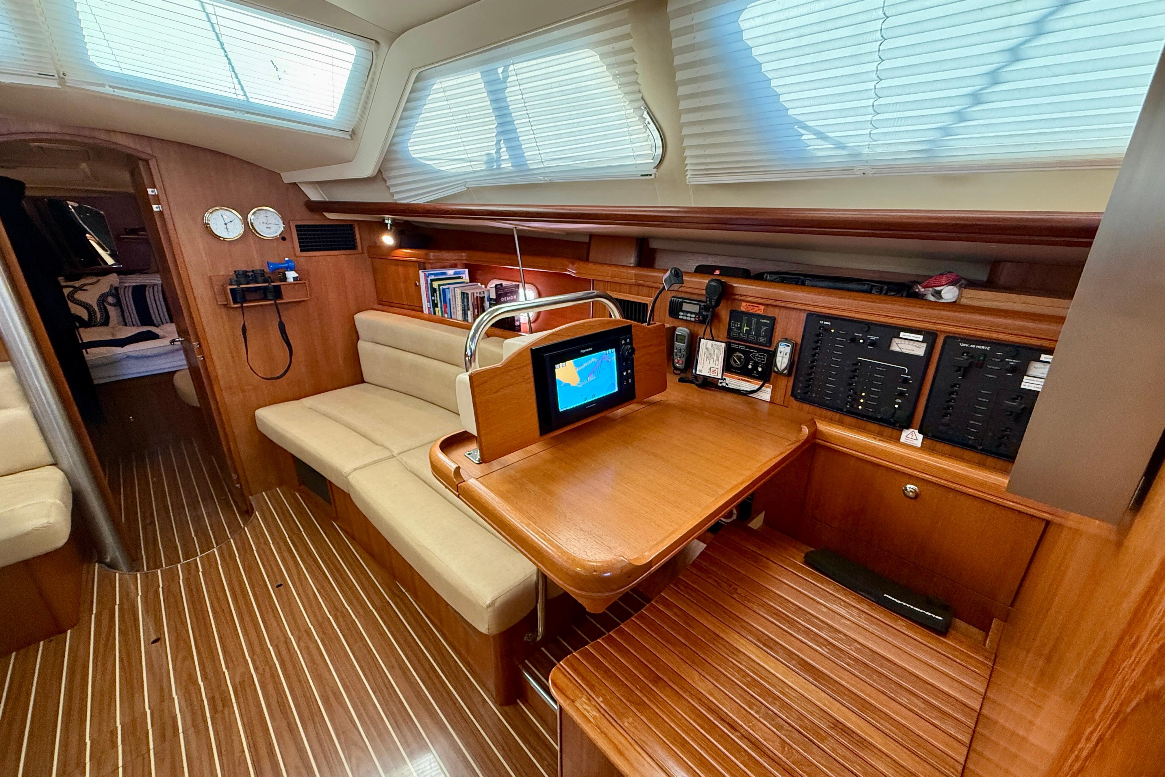 2007 Hunter 44 Deck Salon interior with navigation station and seating area.