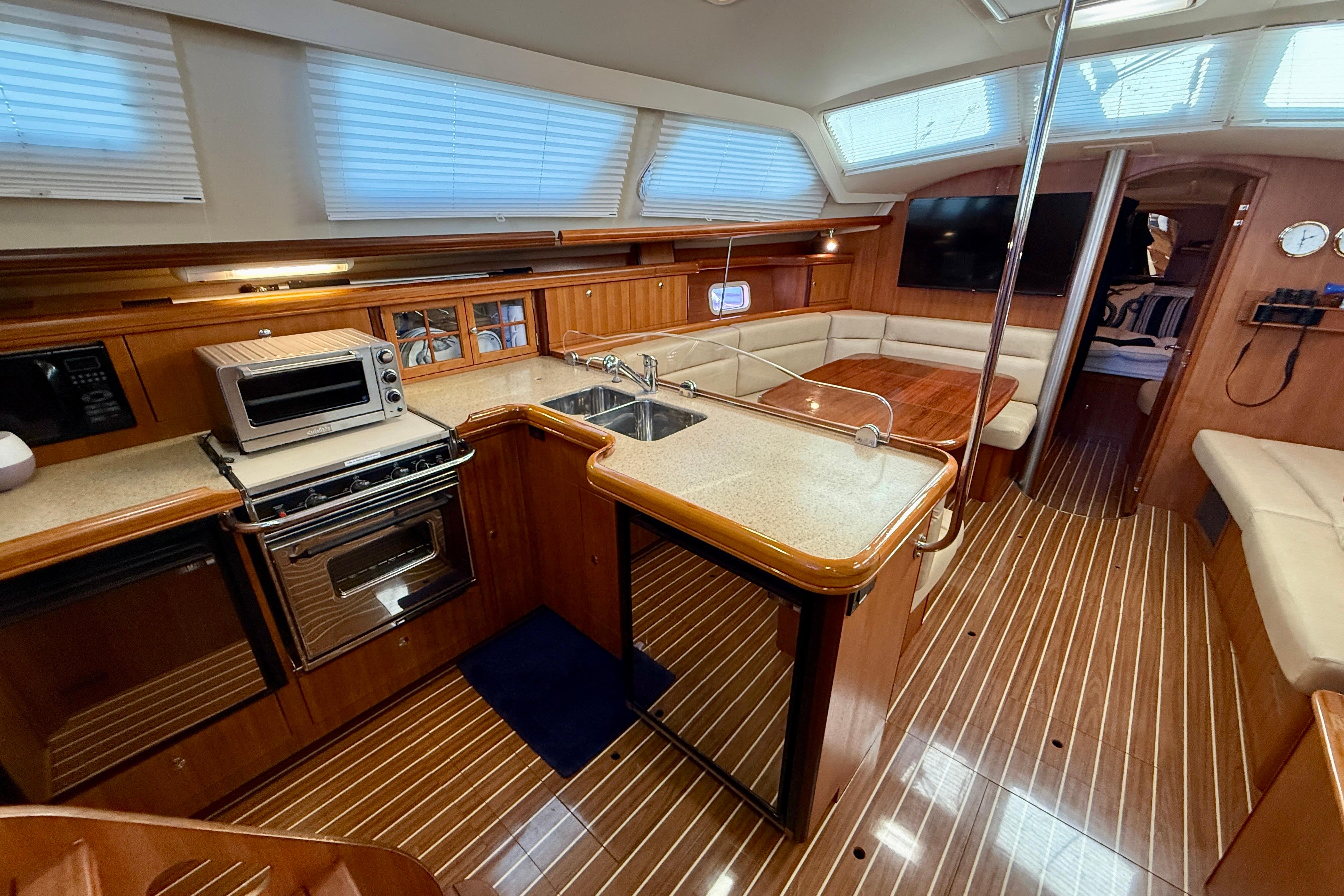 Luxurious 2007 Hunter 44 Deck Salon interior with modern kitchen and cozy seating area.