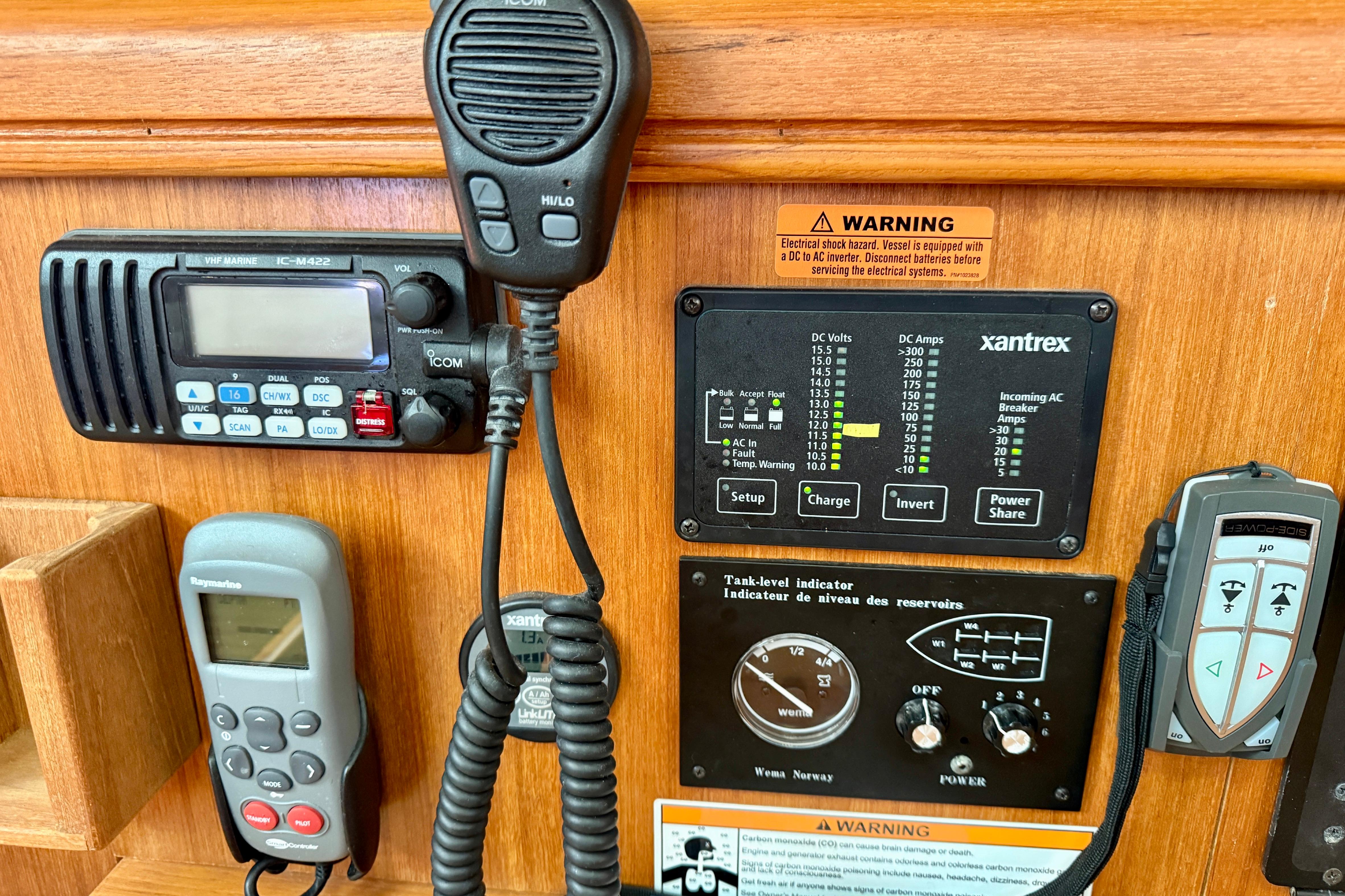 Control panel of a 2007 Hunter 44 Deck Salon with communication and monitoring equipment.