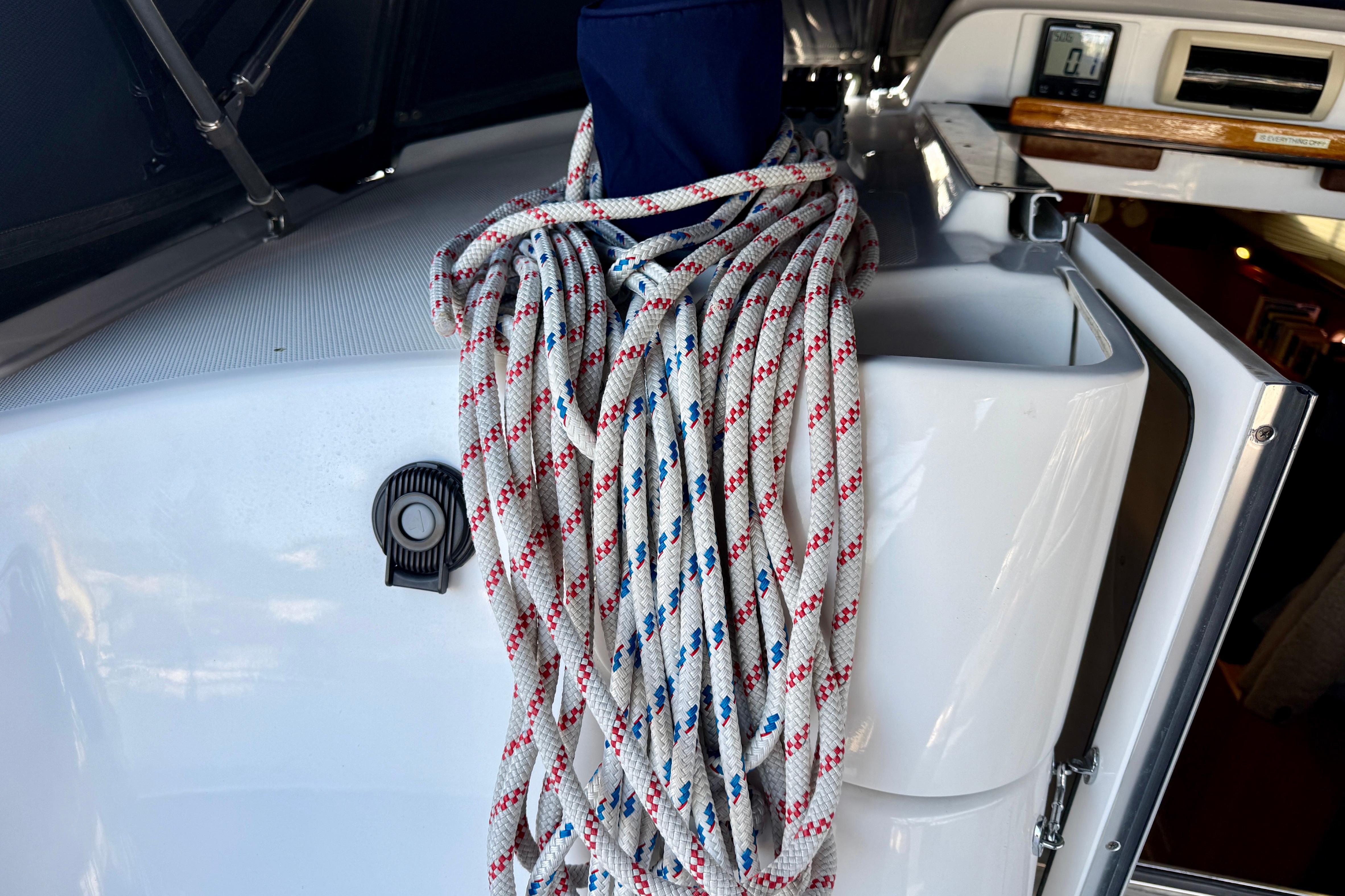 Coiled rope on 2007 Hunter 44 Deck Salon yacht, showcasing deck details.