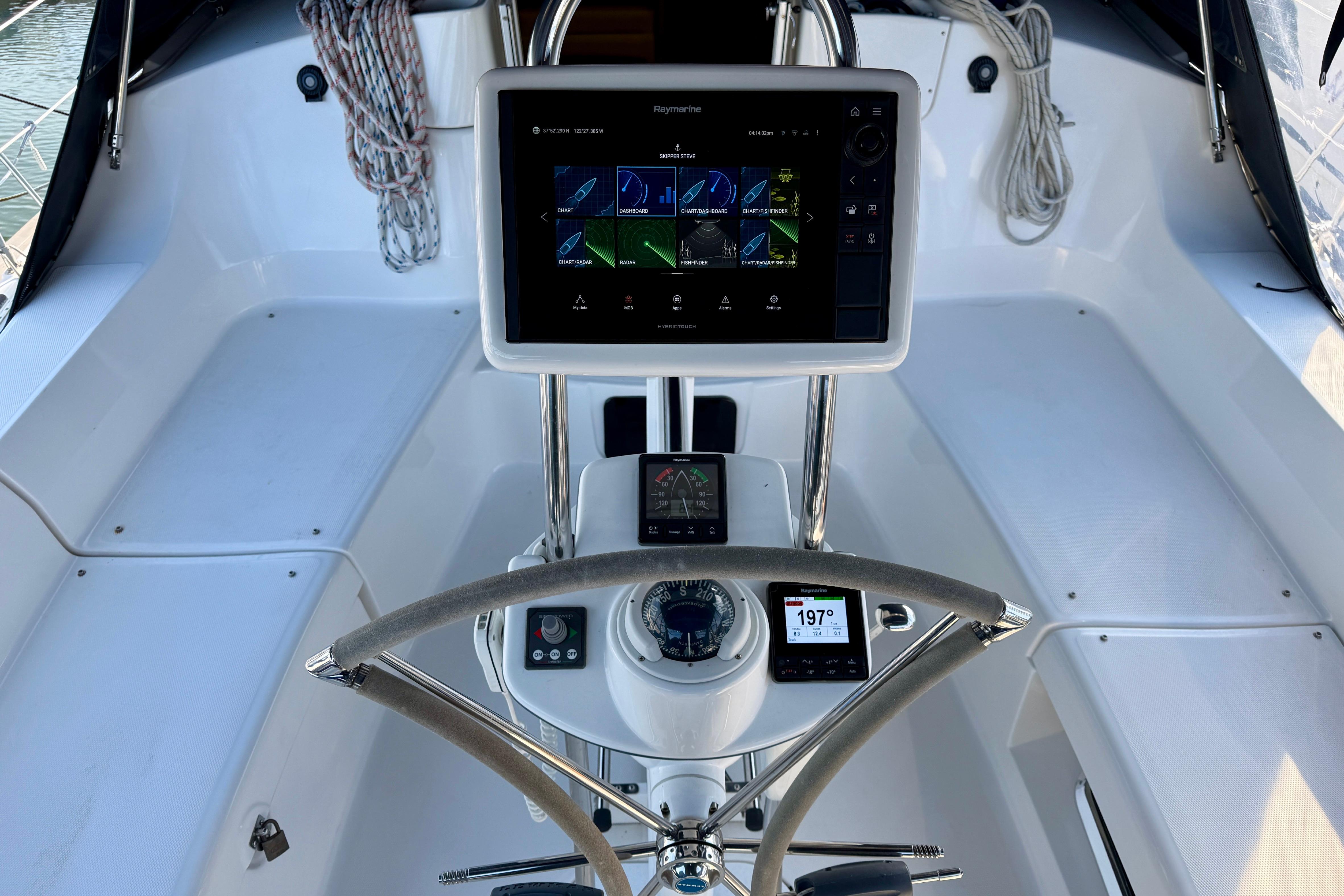 Cockpit of 2007 Hunter 44 Deck Salon with navigation equipment and steering wheel.
