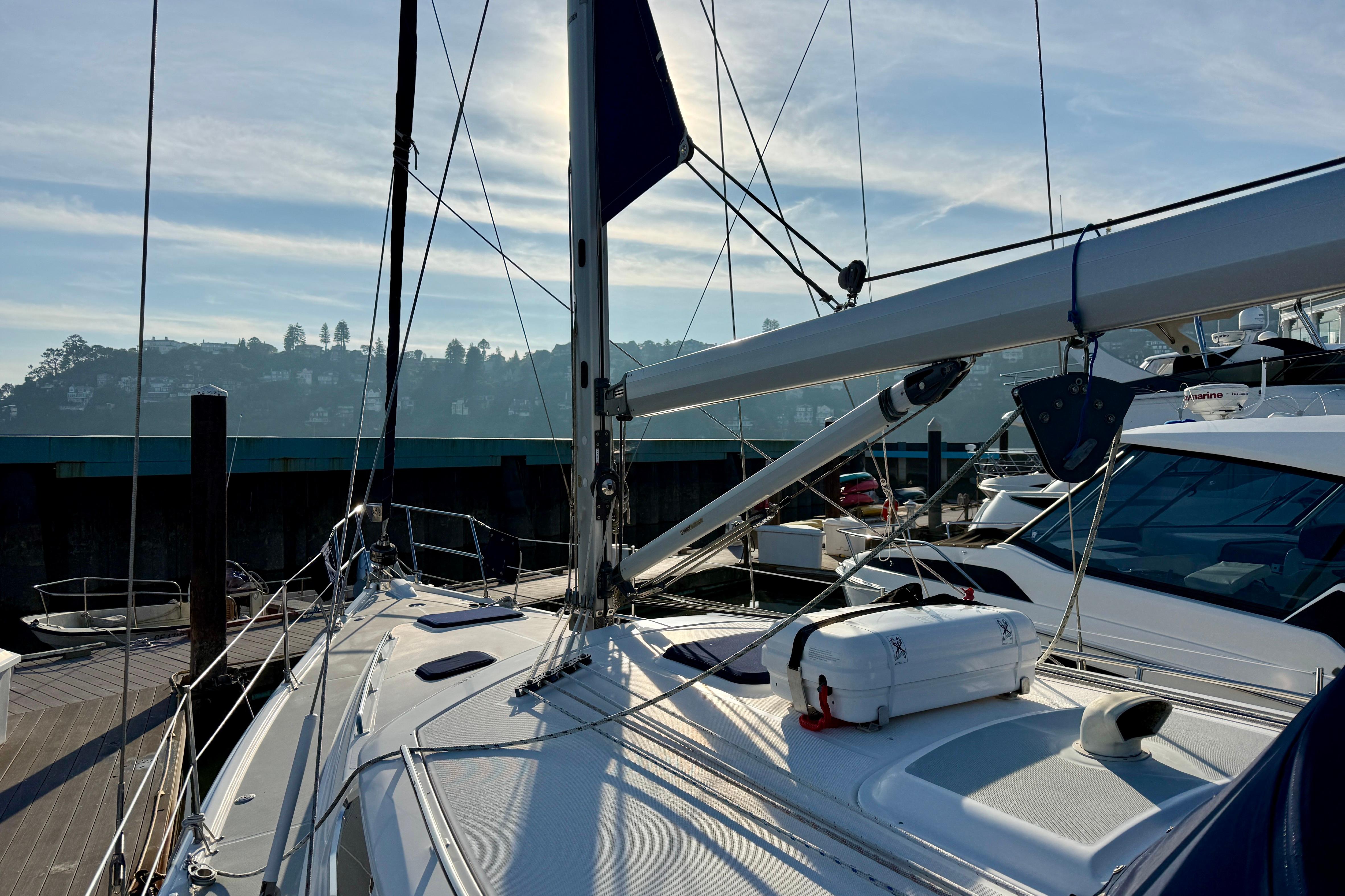 Sailboat docked at marina, Hunter 44 Deck Salon, 2007 model, sunny day.