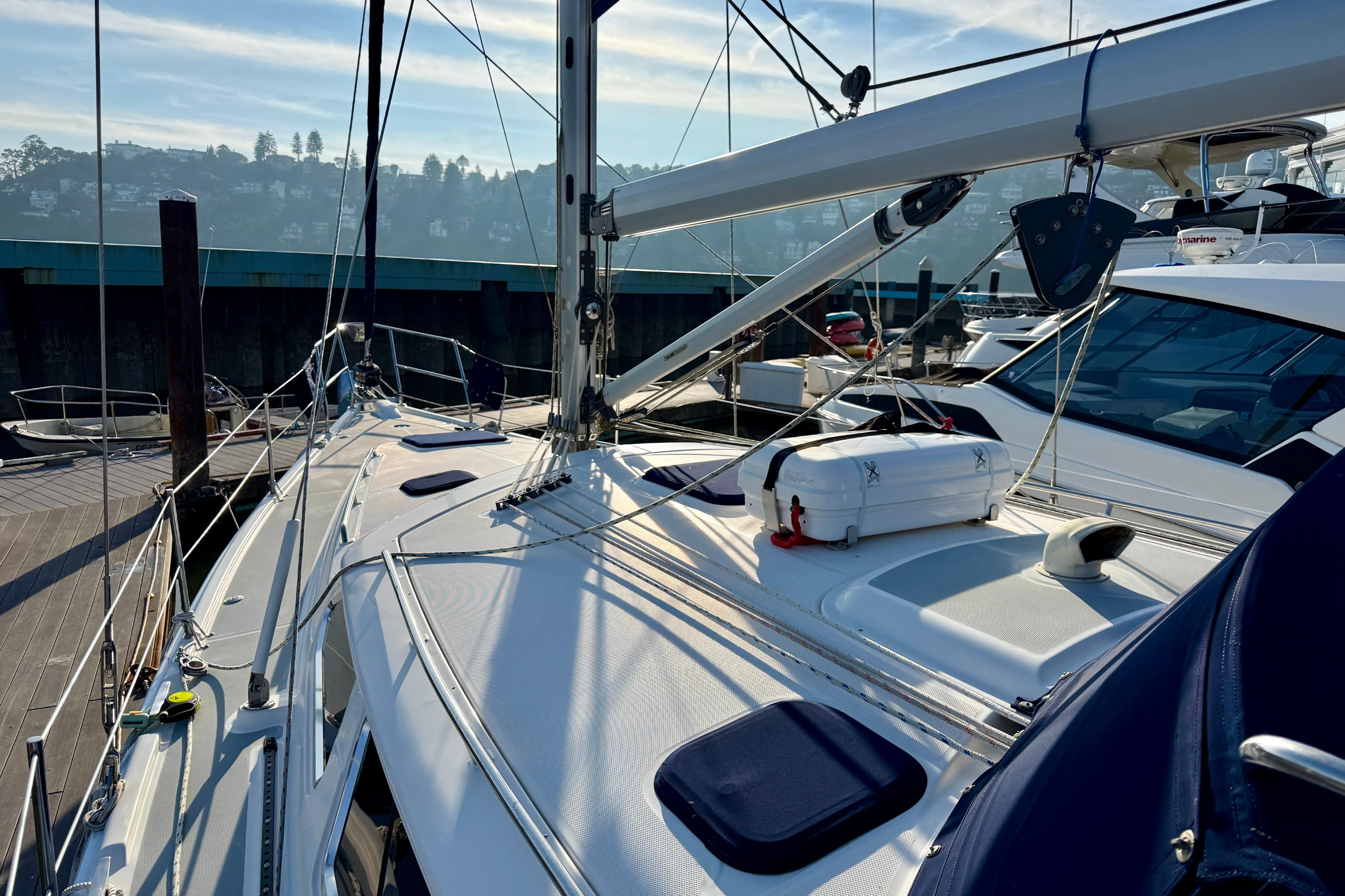 2007 Hunter 44 Deck Salon sailboat docked, showcasing deck and rigging details.