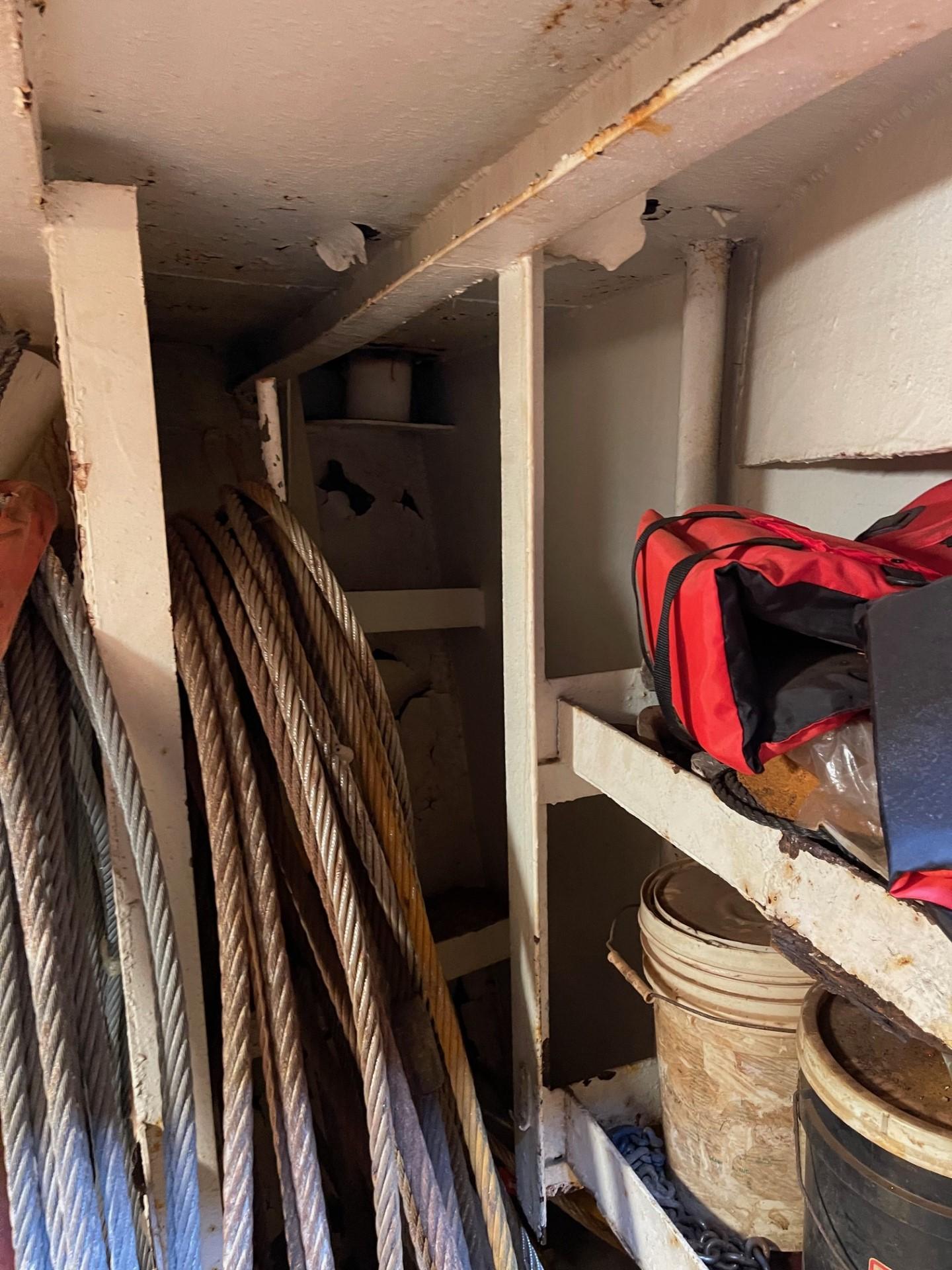 Commercial-Model Bow Tug 1961 -FL-US-Interior of a 1961 Commercial Model Bow Tug with ropes and storage items.-9787034 | Thumbnail