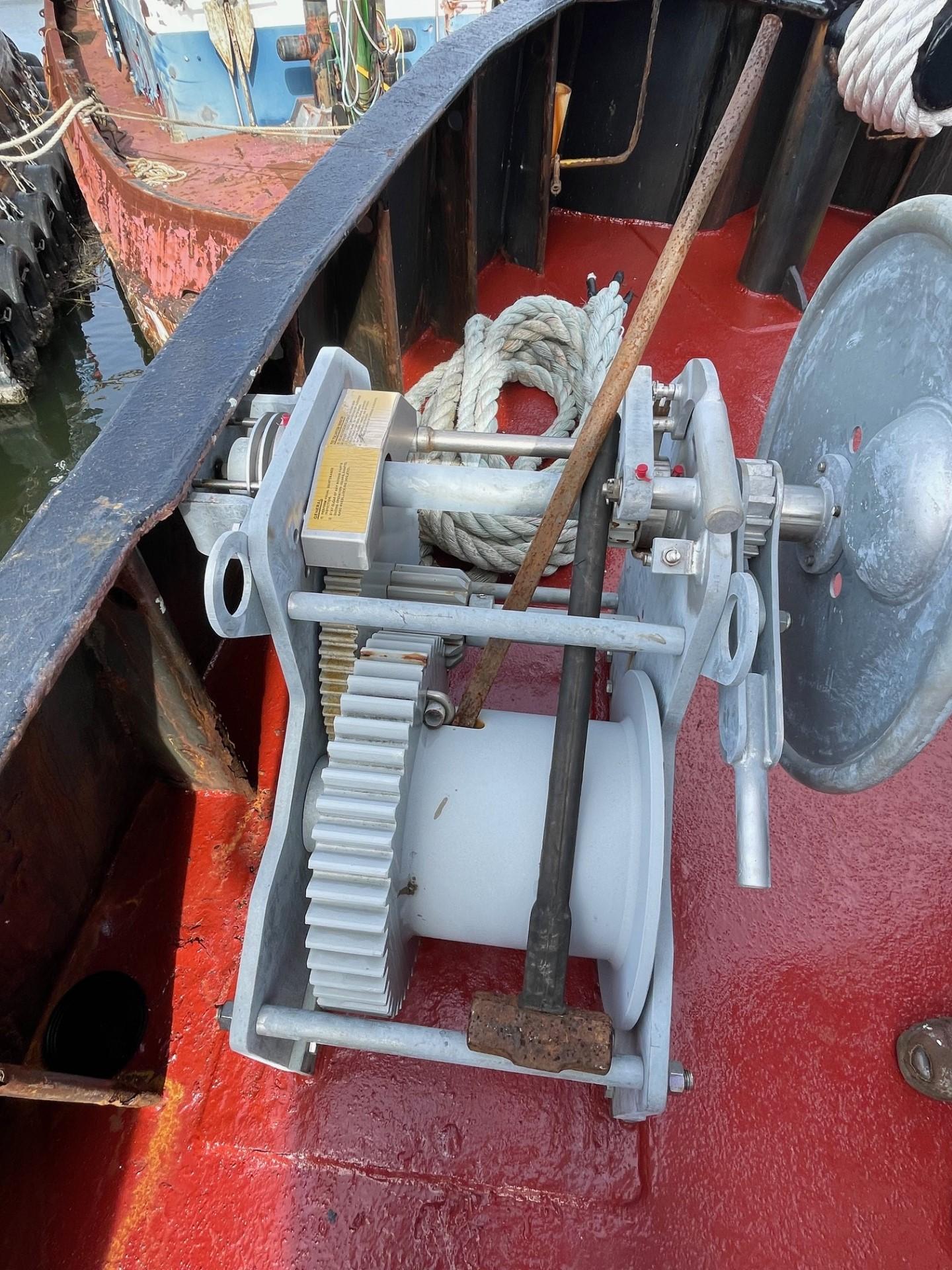 Commercial-Model Bow Tug 1961 -FL-US-Winch mechanism on 1961 Commercial Model Bow Tug, featuring gears and rope on red deck.-9787034 | Thumbnail
