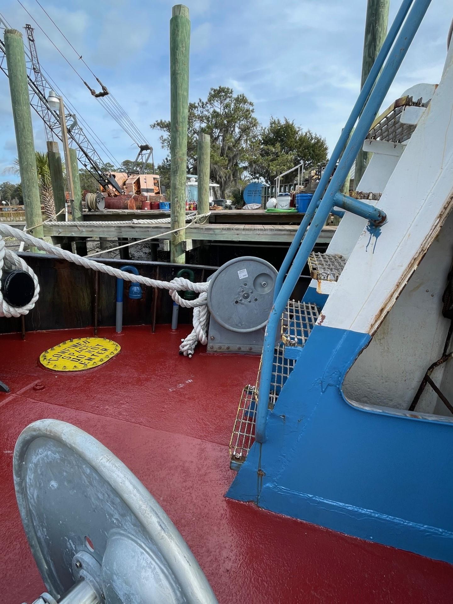 Commercial-Model Bow Tug 1961 -FL-US-1961 Commercial Model Bow Tug at dock, featuring red deck and blue accents.-9787034 | Thumbnail