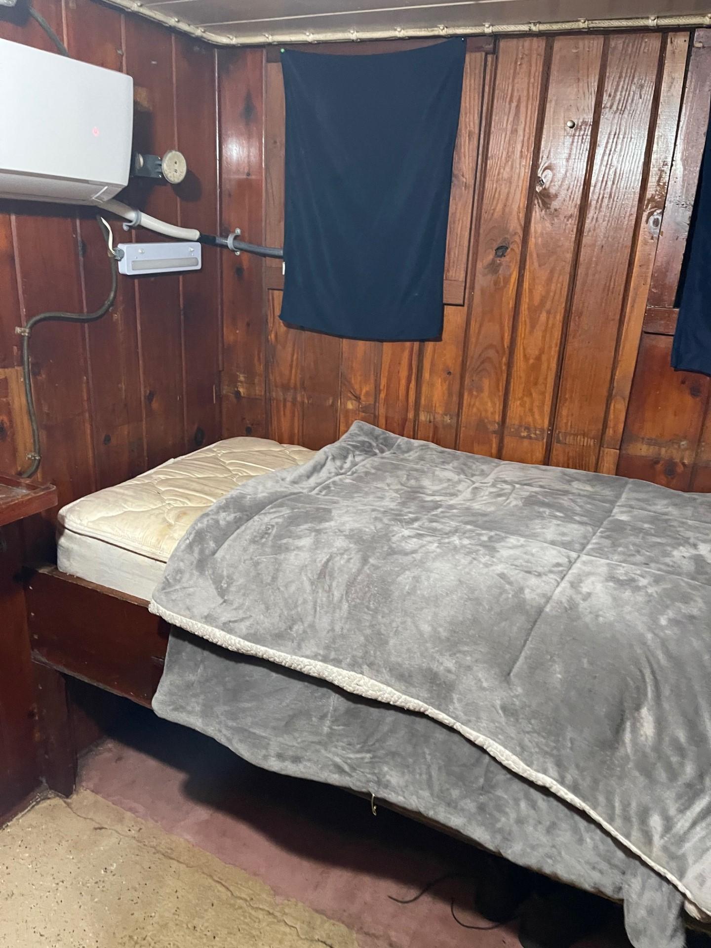 Commercial-Model Bow Tug 1961 -FL-US-Cozy wooden cabin interior of 1961 Model Bow Tug with bed and air conditioning.-9787034 | Thumbnail