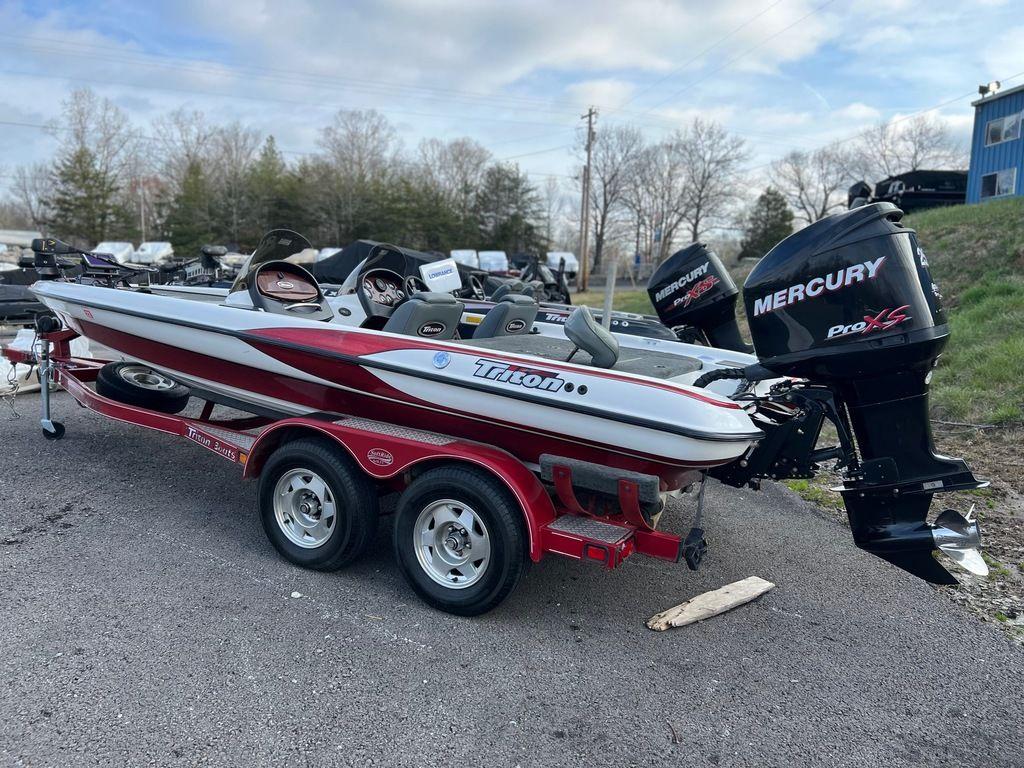1999 Triton TR20 boat with Mercury Pro XS engine on a trailer.